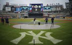 A couple of Twins players, including Minnesota Twins second baseman Luis Arraez, fielded grounders in the drizzle at Yankee Stadium Thursday afternoon