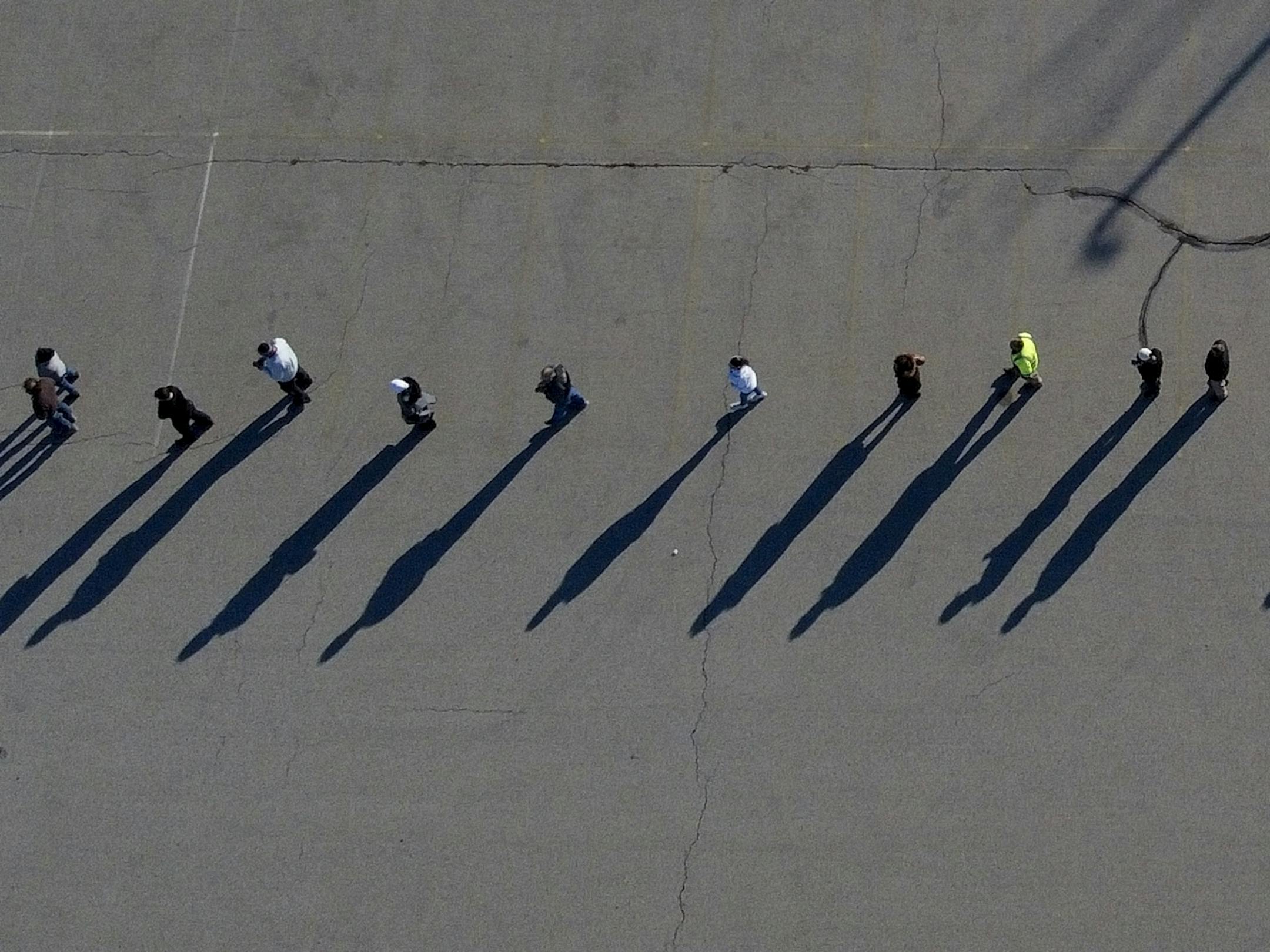 People line up to vote at the Milwaukee County Sports Complex Tuesday, Nov. 3, 2020, in Franklin, Wis.