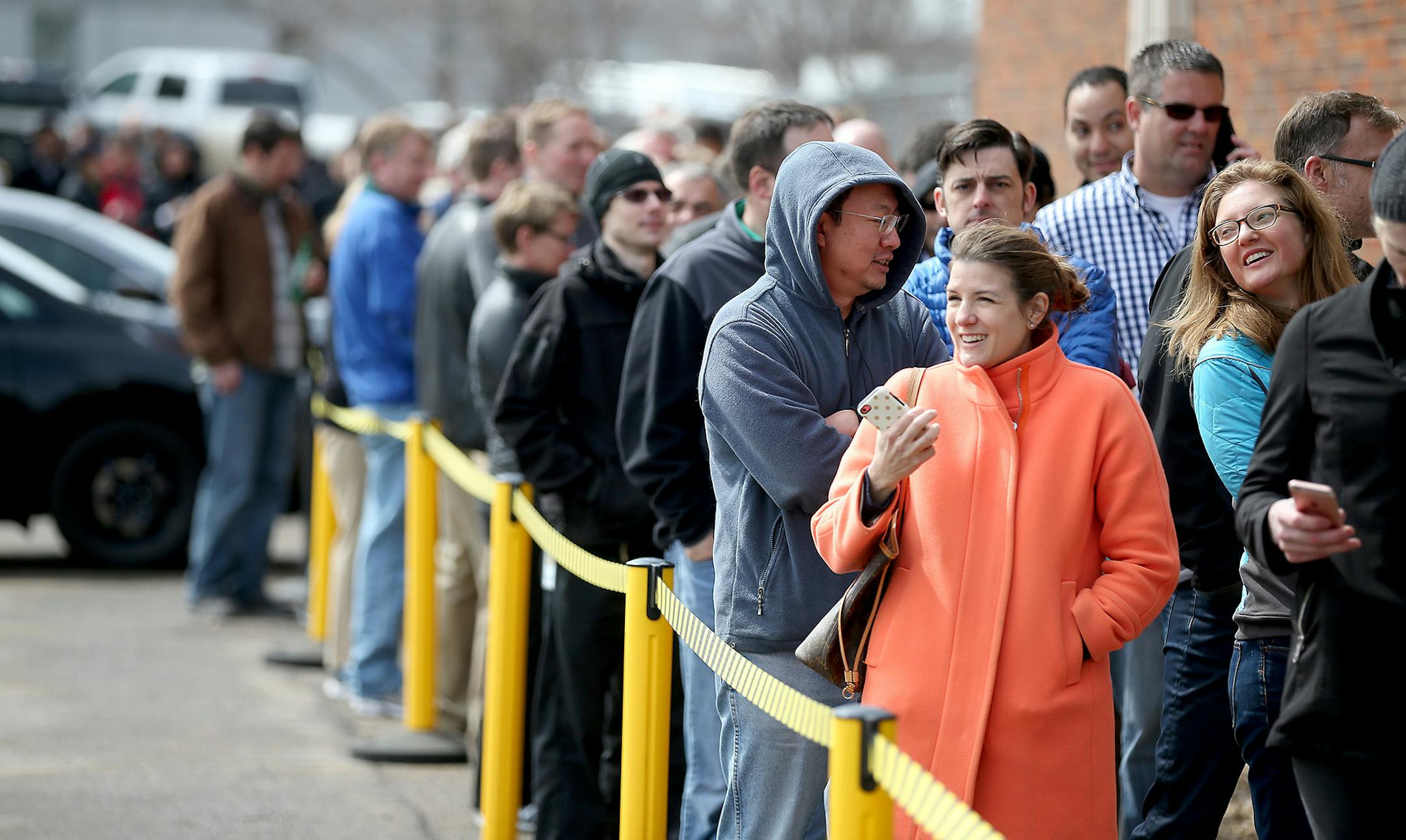 Car enthusiasts lined up outside Tesla in Eden Prairie, MN, Thursday March 31, 2016. They did this to get on a waiting list for the new Model 3 electric car. With a starting price of $35,000 before government incentives, the Model 3 is less than half the cost of Tesla's previous models. The car will be revealed Thursday night at its Los Angeles design studio. ] (ELIZABETH FLORES/STAR TRIBUNE) ELIZABETH FLORES � eflores@startribune.com