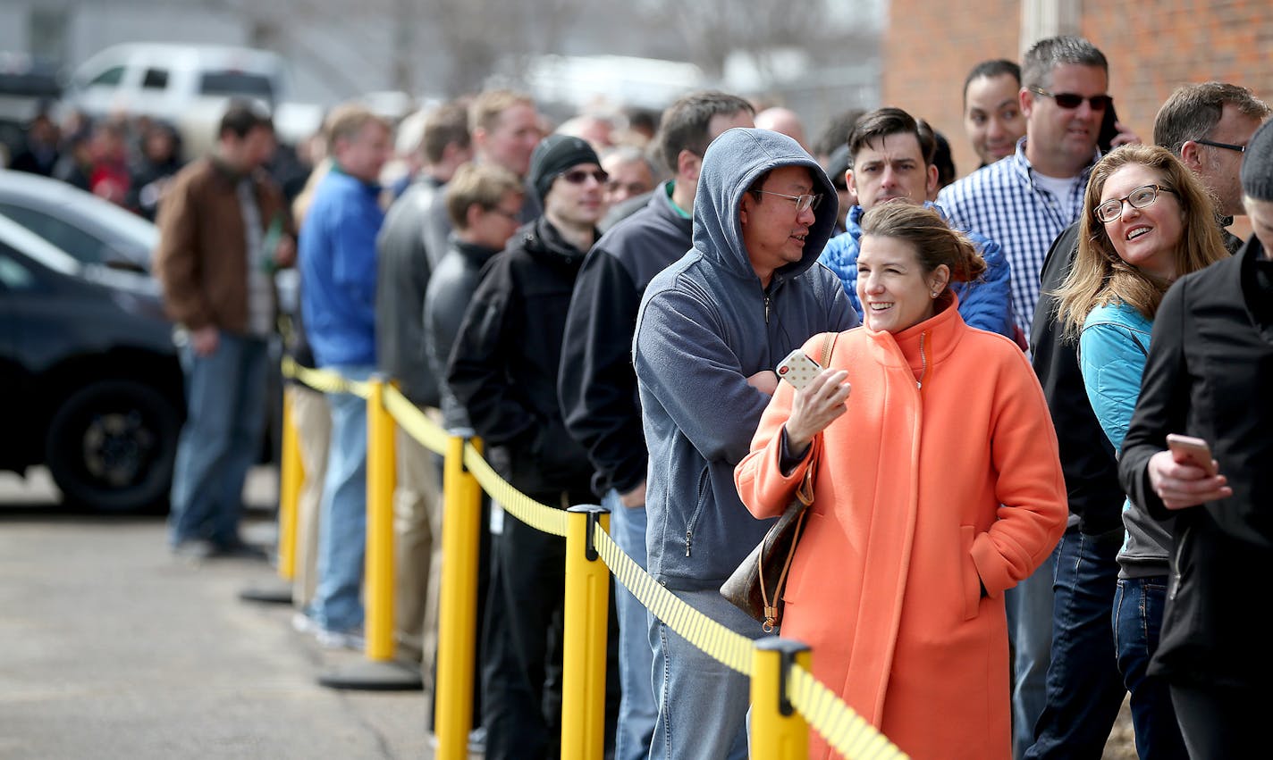 Car enthusiasts lined up outside Tesla in Eden Prairie, MN, Thursday March 31, 2016. They did this to get on a waiting list for the new Model 3 electric car. With a starting price of $35,000 before government incentives, the Model 3 is less than half the cost of Tesla's previous models. The car will be revealed Thursday night at its Los Angeles design studio. ] (ELIZABETH FLORES/STAR TRIBUNE) ELIZABETH FLORES � eflores@startribune.com