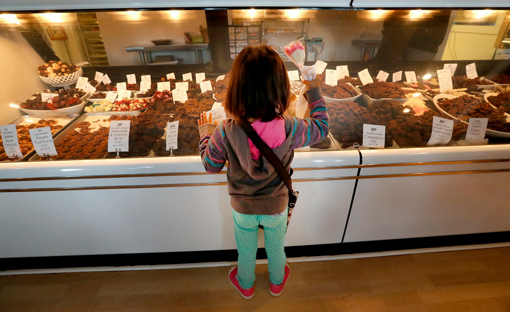 Adeline Monsen, 4, of Chaska looked at the candy on display at Great! Lakes Candy Kitchen up the shore north of Duluth.