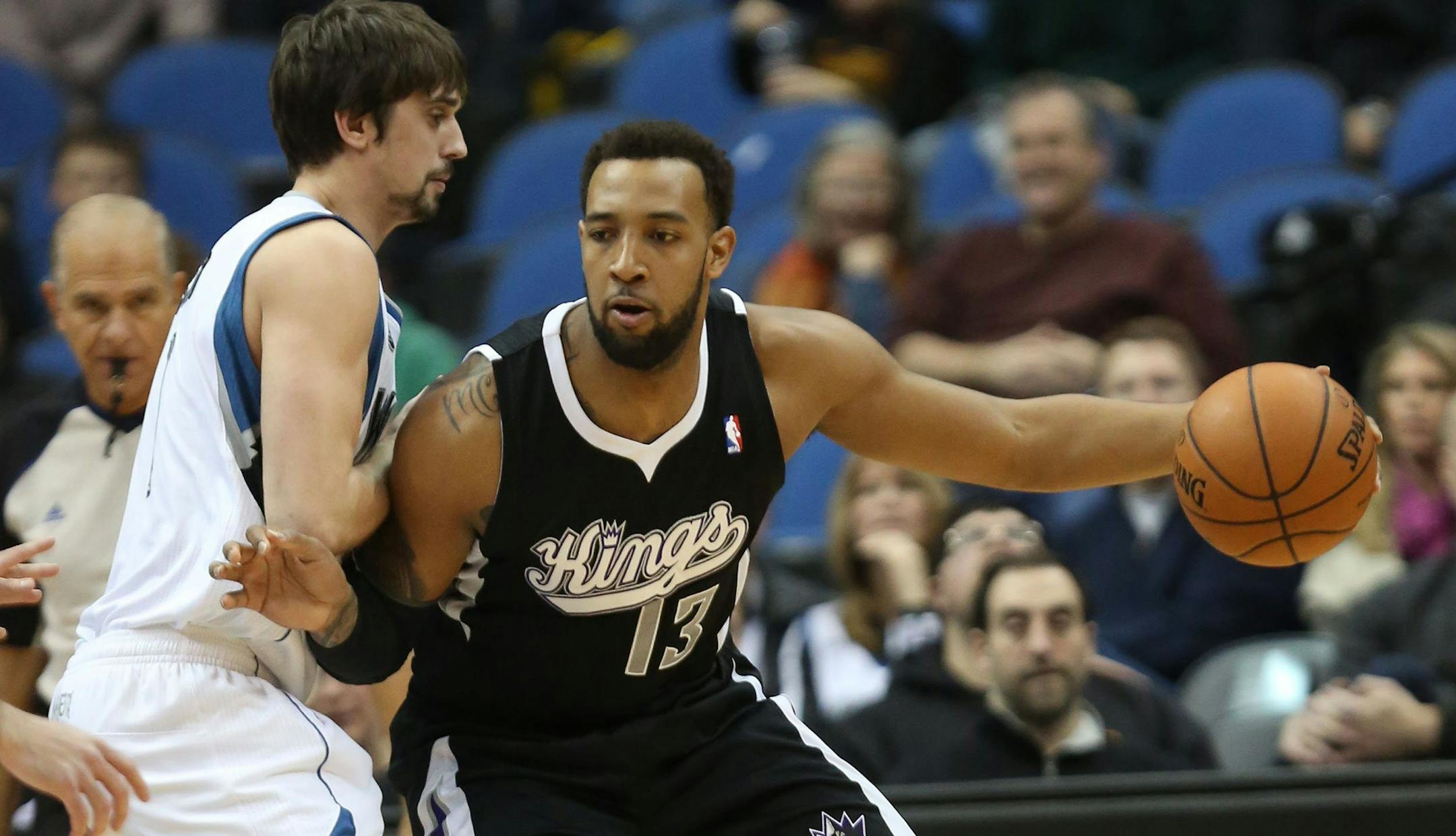 Derrick Williams, right, works off the dribble against the Minnesota Timberwolves' Alexey Shved at the Target Center in Minneapolis on Wednesday, Jan. 15, 2014.