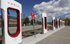 In this Saturday, June 8, 2019, photograph, a Tesla supercharging station in Silverthorne, Colo. (AP Photo/David Zalubowski)