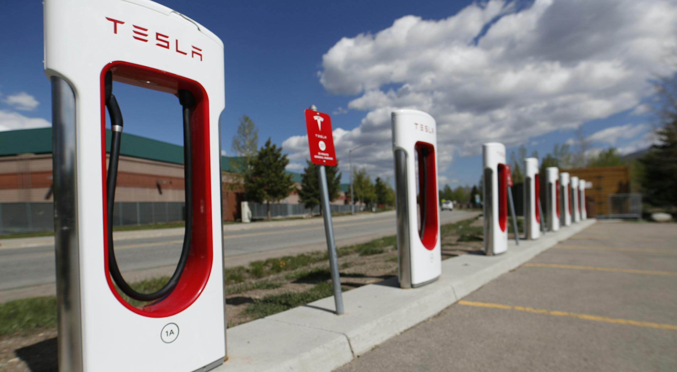 In this Saturday, June 8, 2019, photograph, a Tesla supercharging station in Silverthorne, Colo. (AP Photo/David Zalubowski)