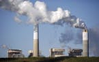 Emissions rise from the coal fired Santee Cooper Cross Generating Station power plant in Pineville, S.C., in March.