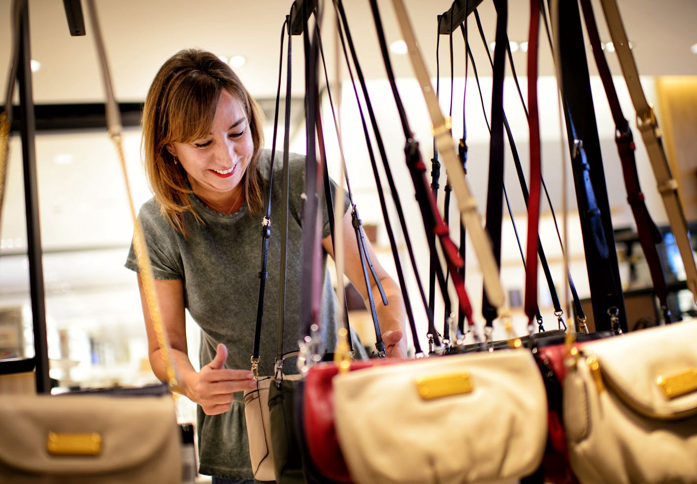 Corinne Arroyo arranged a display of Marc Jacobs handbags at the new Nordstrom Ridgedale, Minnetonka. ] GLEN STUBBE * gstubbe@startribune.com Tuesday September 22, 2015 Nordstrom will open its second Twin Cities' dept. store in Ridgedale on Oct. 2.