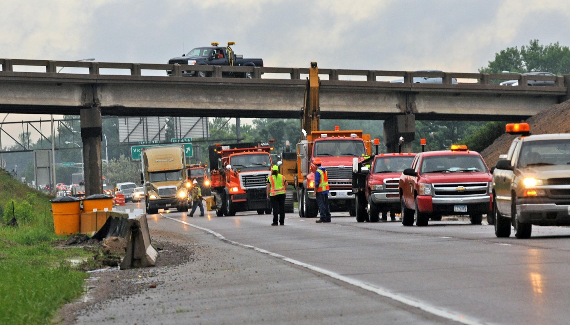 Heavy, persistent rain in the Twin Cities metro clogged the morning commute on Thursday May 24, 2012. Traffic was stopped on 694 West bound between Lexington Ave and Snelling Ave. in Arden Hills. Crews closed the road temporarily due to a mudslide earlier in the morning commute.