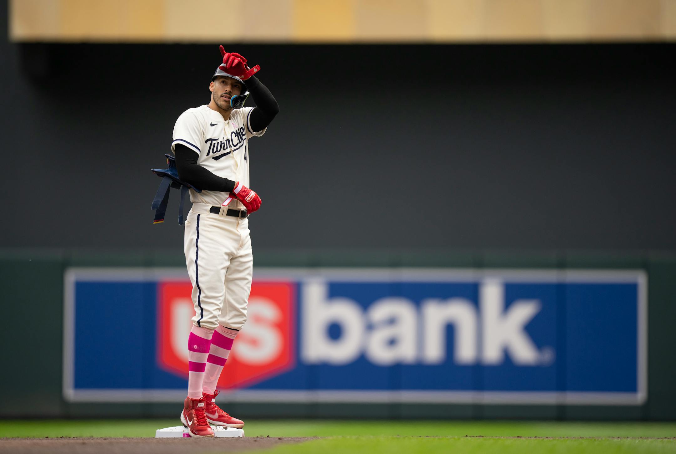 Minnesota Twins shortstop Carlos Correa pointed to the stands after his RBI double in the first inning.