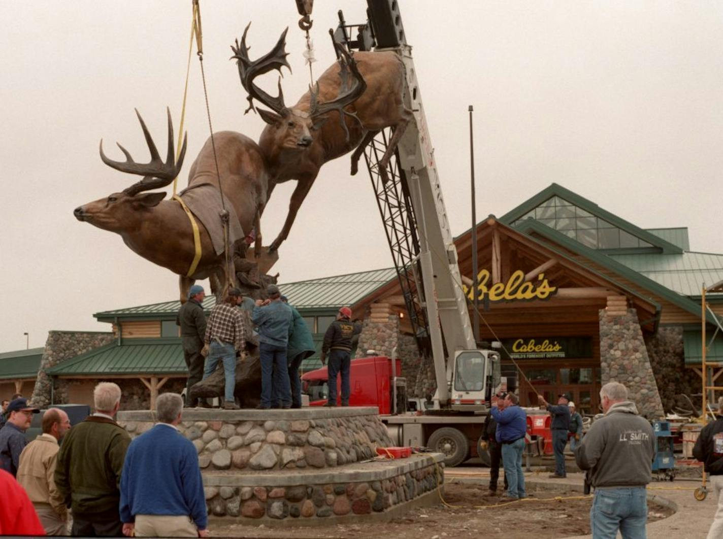 Cabelas super storte in Owatonna Mn -- cabe2.17868 - exterior of Cabela�s - during the installation an 8 ton bronze sculpture of two whitetail bucks by artist Dick Idol.