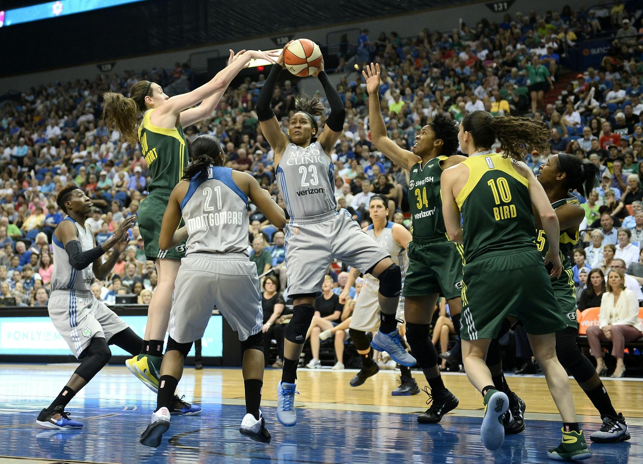 Minnesota Lynx forward Maya Moore (23) pulled down an offensive rebound before scoring a layup against the Seattle Storm in the third quarter Friday night.