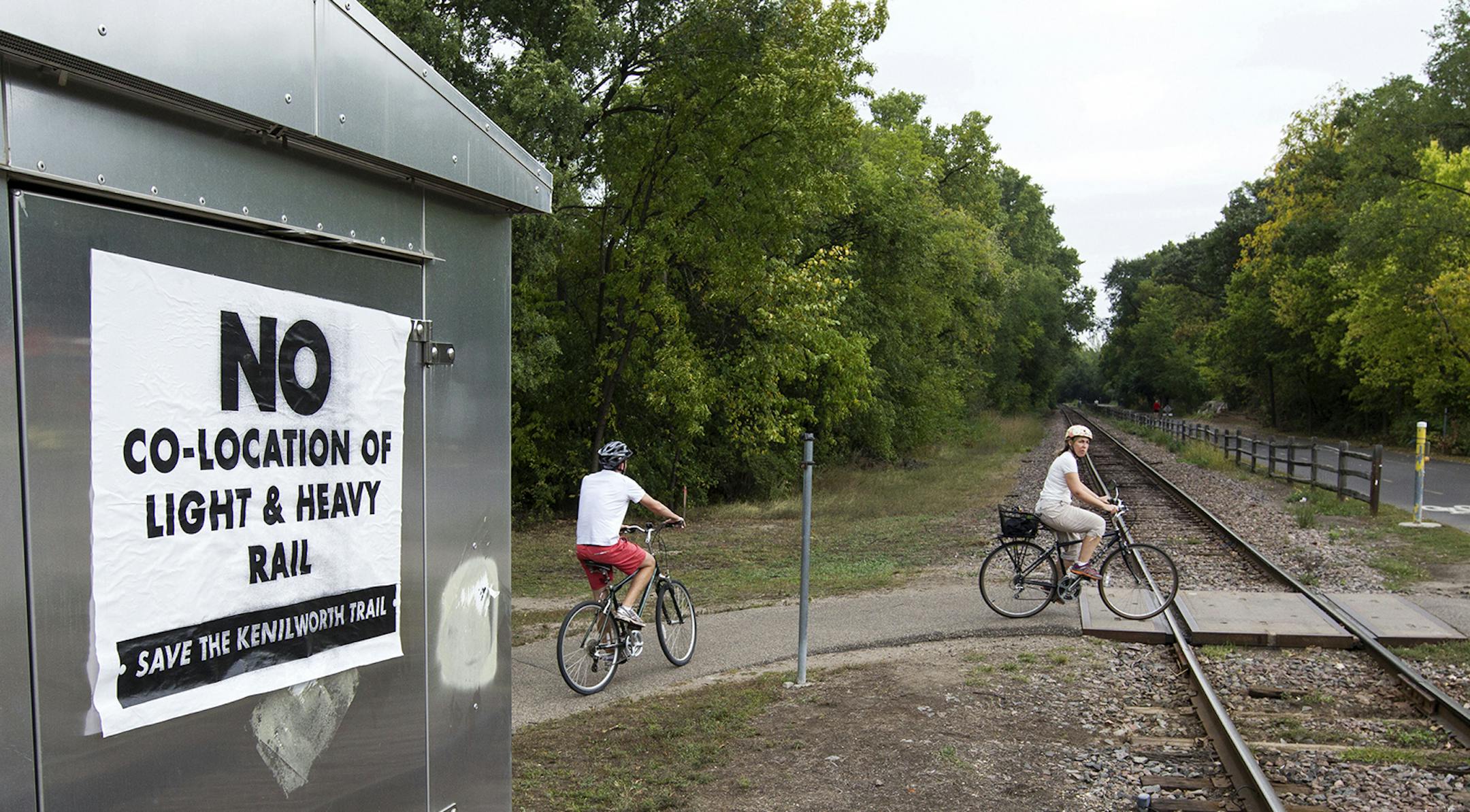 A sign on Kenilworth Trail and Cedar Lake Parkway speaks against co-location of light and heavy rail in Minneapolis September 27, 2013. (Courtney Perry/Special to the Star Tribune) ORG XMIT: MIN1309271555584338 ORG XMIT: MIN1310012101386256