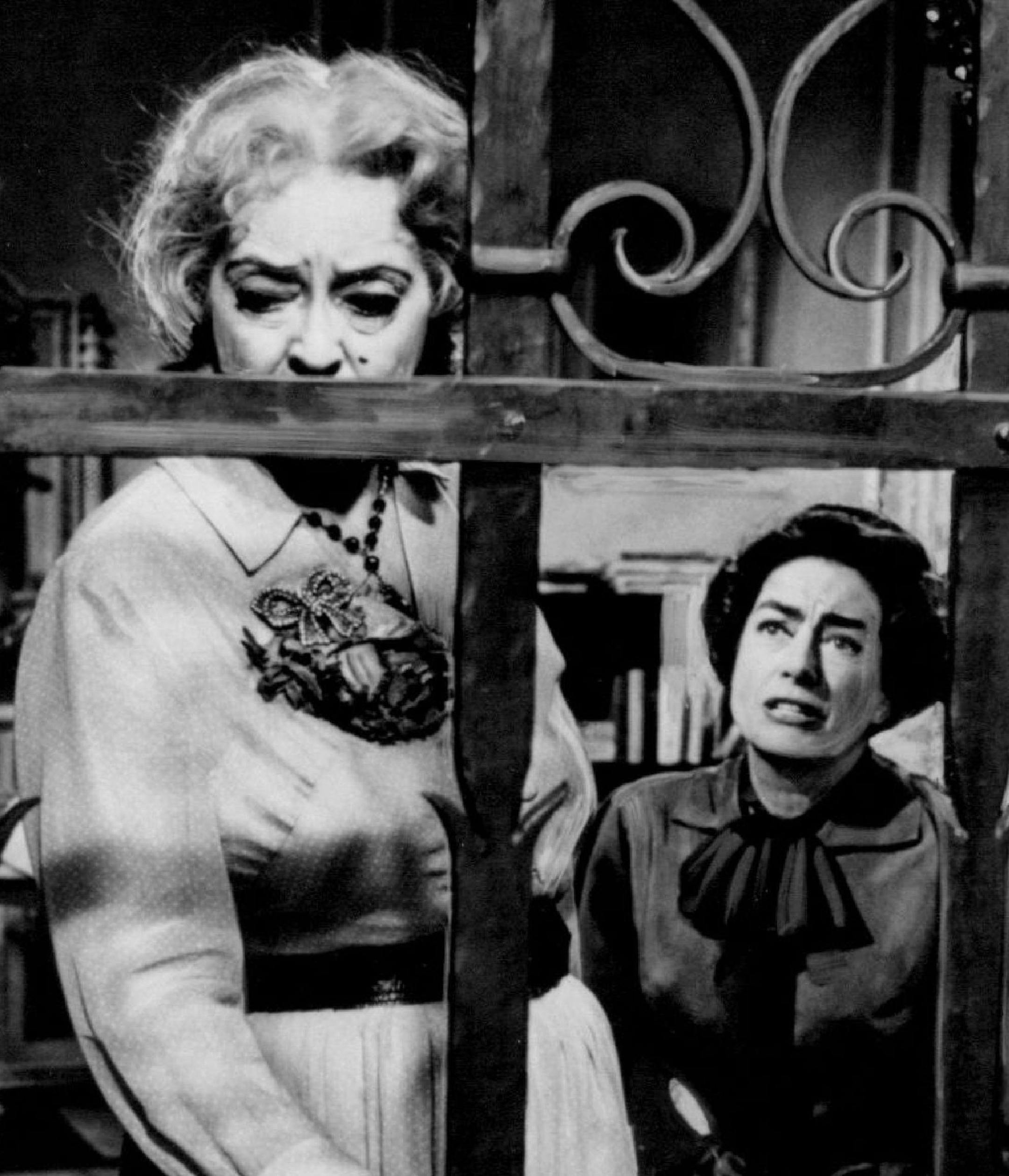 ENTERTAINMENT NEWS SERVICE (7/30/95 VILLAINESSES) Sandra Bullock, on her favorite screen villainess: "I thought Bettle Davis (Pictured here, left, with co-star Joan Crawford) in "What Ever Happened to Baby Jane?' was great. She was frightening. Those amazing eyes! She could just walk into a room and command attention."