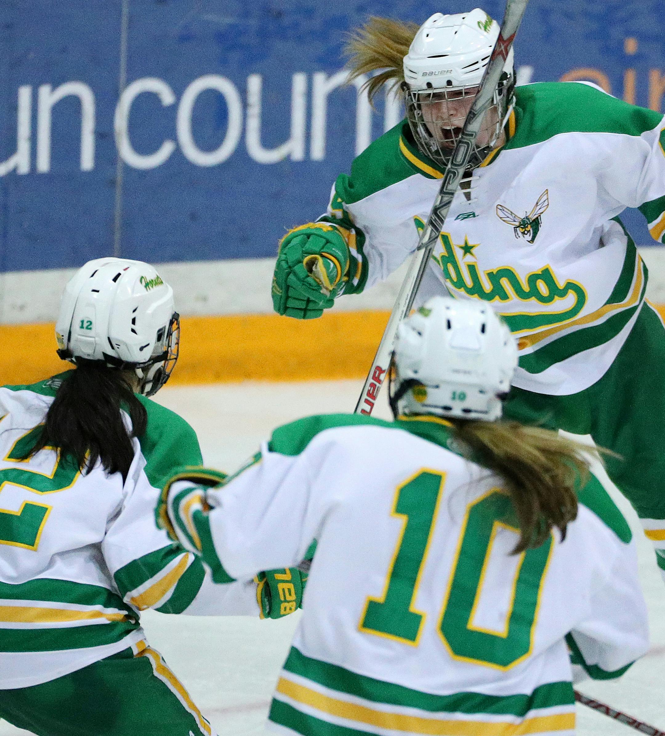 Edina players Lolita Fidler (12), Olivia Kilberg (9), and Sophie Slattery (10) celebrate the team's second goal of the night in the third period. ] ANTHONY SOUFFLE ï anthony.souffle@startribune.com Game action from a sectional finals girls prep hockey game between Edina High School and Cretin-Derham Hall Friday, Feb. 17, 2017 at Ridder Arena on the grounds of the University of Minnesota in Minneapolis.