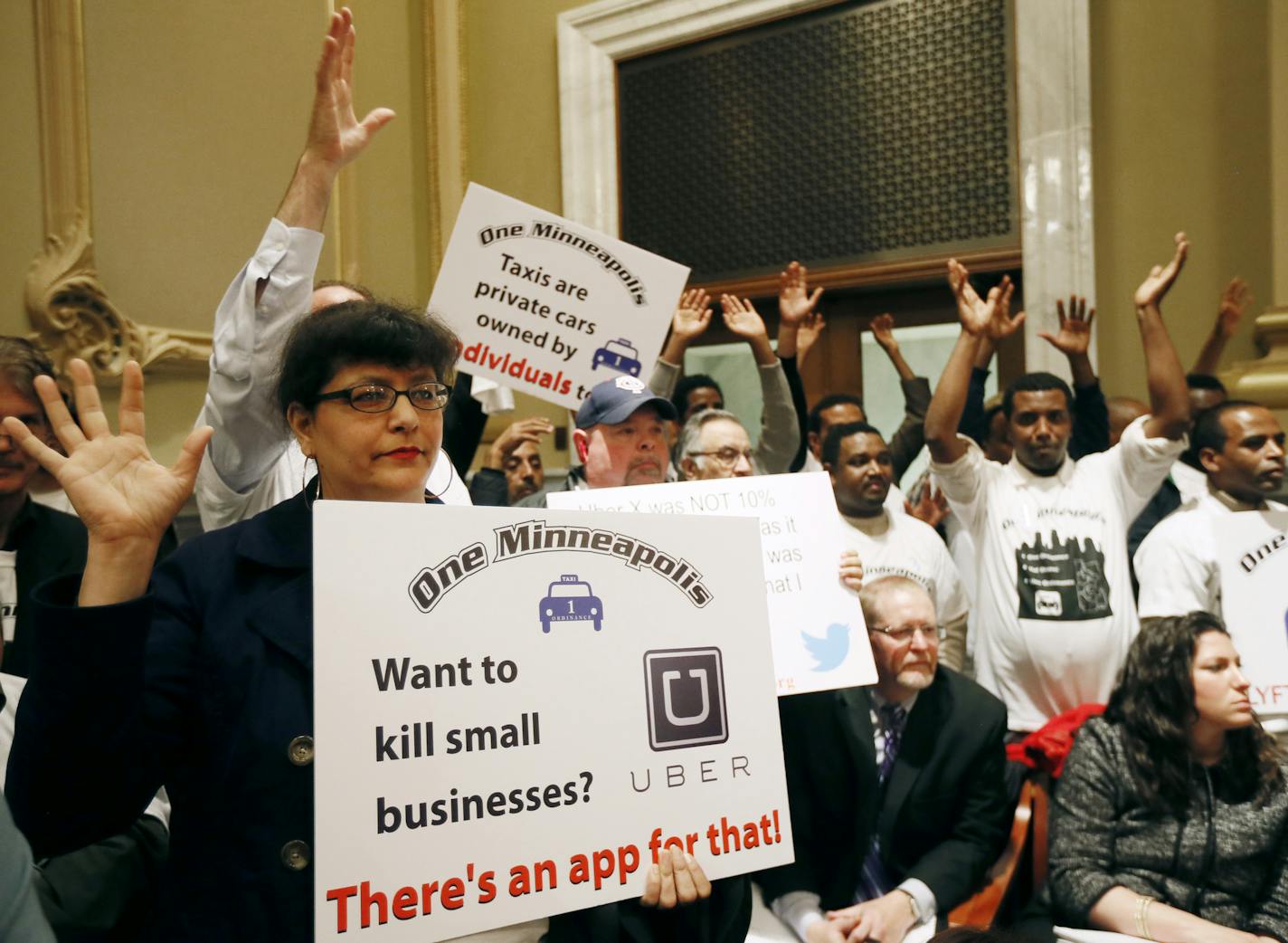 Bambi Barclay a driver for Blue &White and other driver attend the Minneapolis City council meeting on Tuesday. Taxi drivers and supporters of app-based transportation companies testified on a bill that would legalize services like Lyft and Uber to the Minneapolis city council Tuesday April 29, 2014 in Minneapolis, MN. ] Jerry Holt Jerry.holt@startribune.com