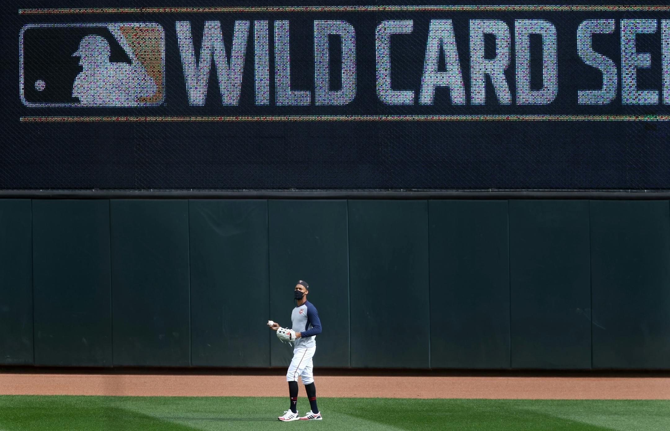 Minnesota Twins center fielder Byron Buxton (25) caught fly balls in the outfield during batting practice.