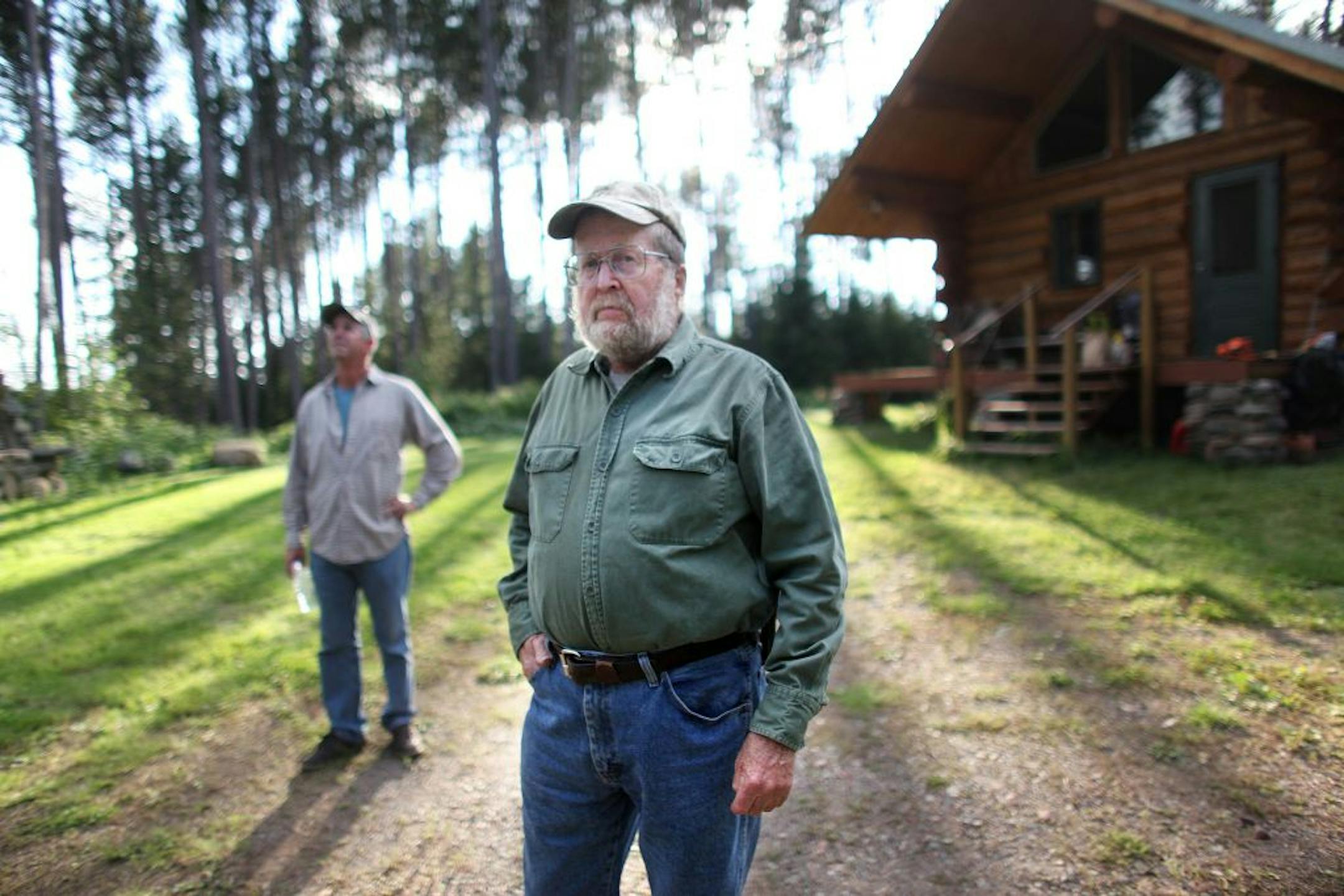 Ron Brodigan and his son Steve Brodigan (left) stood on Steve's property that neighbors Ron's on Sunday, August 14, 2011, near Ely, Minn. Ron and his son live on one of the largest untapped deposits of copper and nickel in the world and can do nothing to stop potential future mining on their private properties. (RENEE JONES SCHNEIDER/ reneejones@startribune.com) Ron and Steve Brodigan