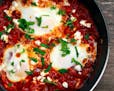 Shakshuka — eggs poached in a tomato sauce with onions and peppers — is one of many dishes forecast as up-and-coming in 2018.
