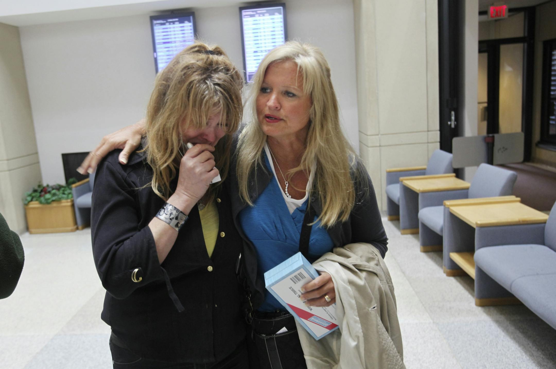 Jill Robinson, left, became emotional while talking about the sentence as her sister Wendy Hatchner comforted her at the Anoka County Courthouse.