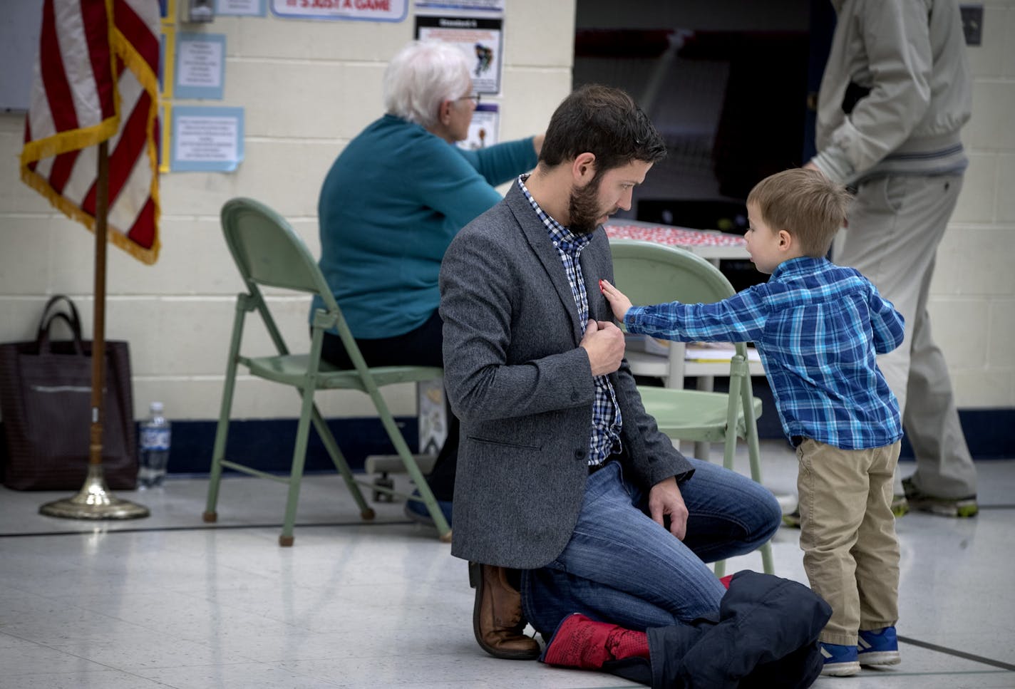 Three-year-old Josef Kuzel placed the red "I Voted" sticker on his father Bryan Kuzel after he cast his vote at Somerset Elementary School, Tuesday, November 6, 2018 in Mendota Heights, MN.