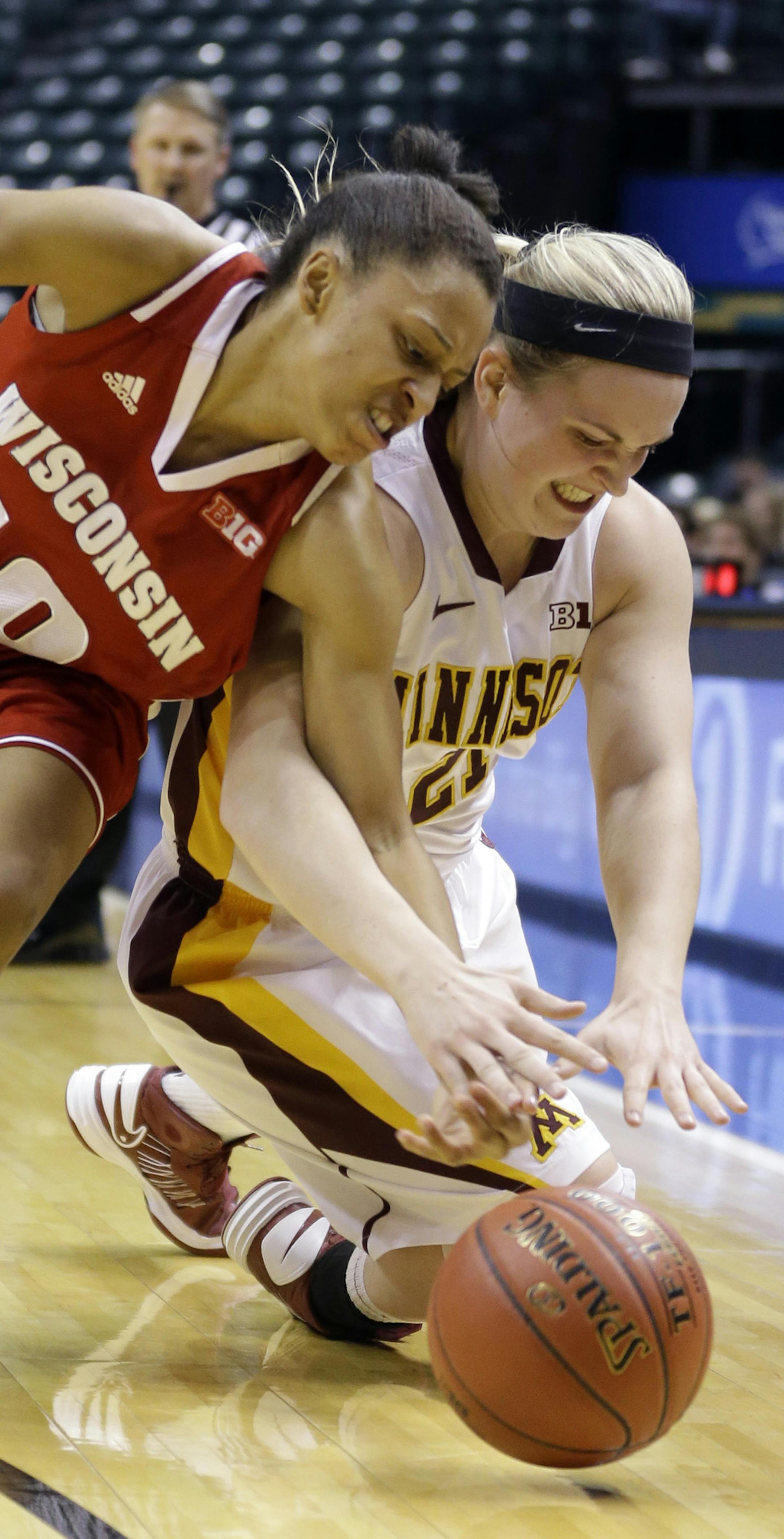 Wisconsin guard Dakota Whyte, left, and Minnesota guard Sari Noga go for a loose ball in the first half of an NCAA college basketball game in the opening round of the Big Ten Tournament in Indianapolis, Ind., Thursday, March 6, 2014. (AP Photo/Michael Conroy)