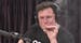 Elon Musk, chairman and CEO at Tesla and chairman of SpaceX, inhales what he said was marijuana on a live YouTube webcast Thursday night. (Screenshot/