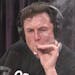 Elon Musk, chairman and CEO at Tesla and chairman of SpaceX, inhales what he said was marijuana on a live YouTube webcast Thursday night. (Screenshot/