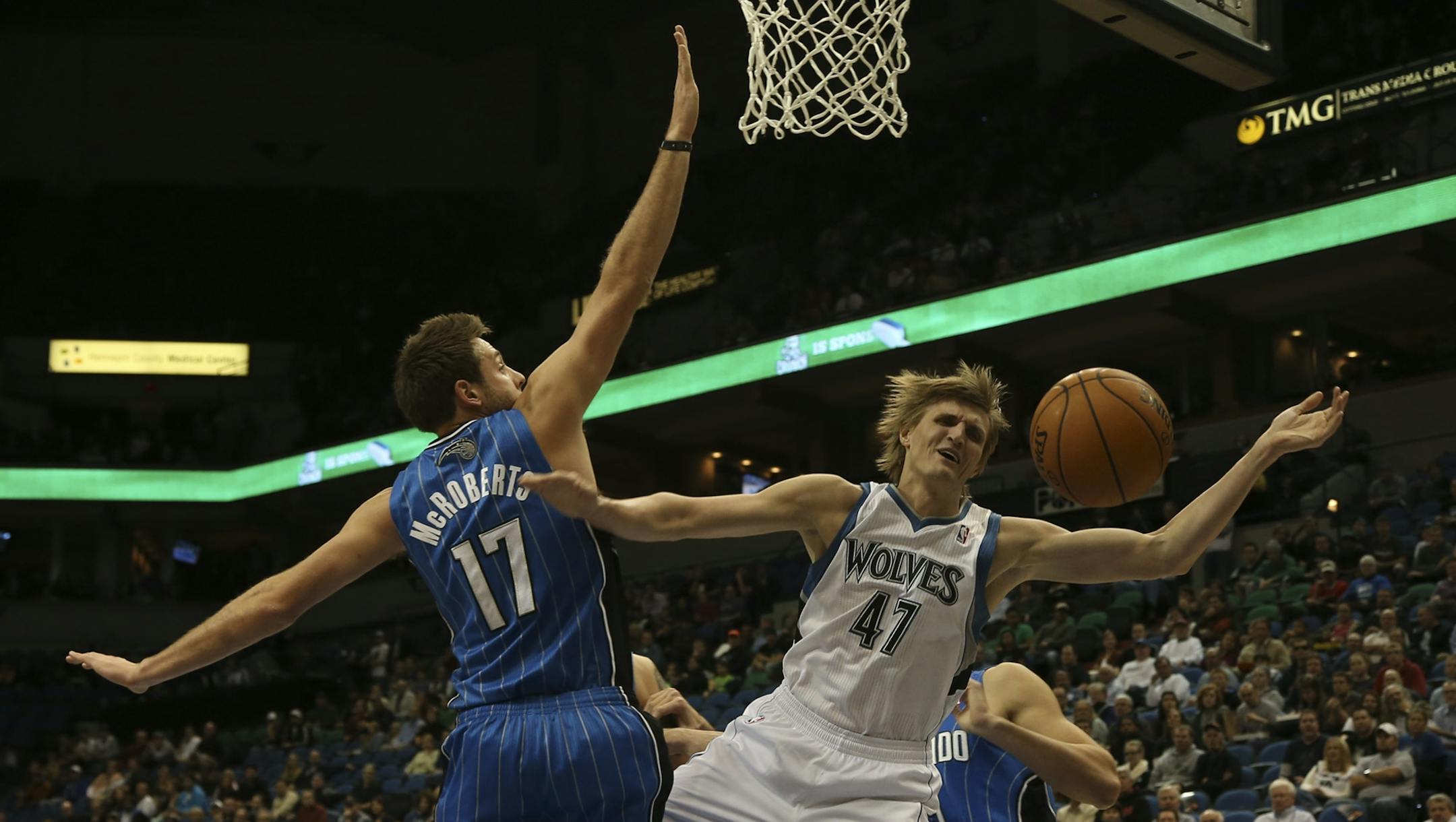 Andrei Kirilenko was fouled going to the basket by the Magic's Josh McRoberts.