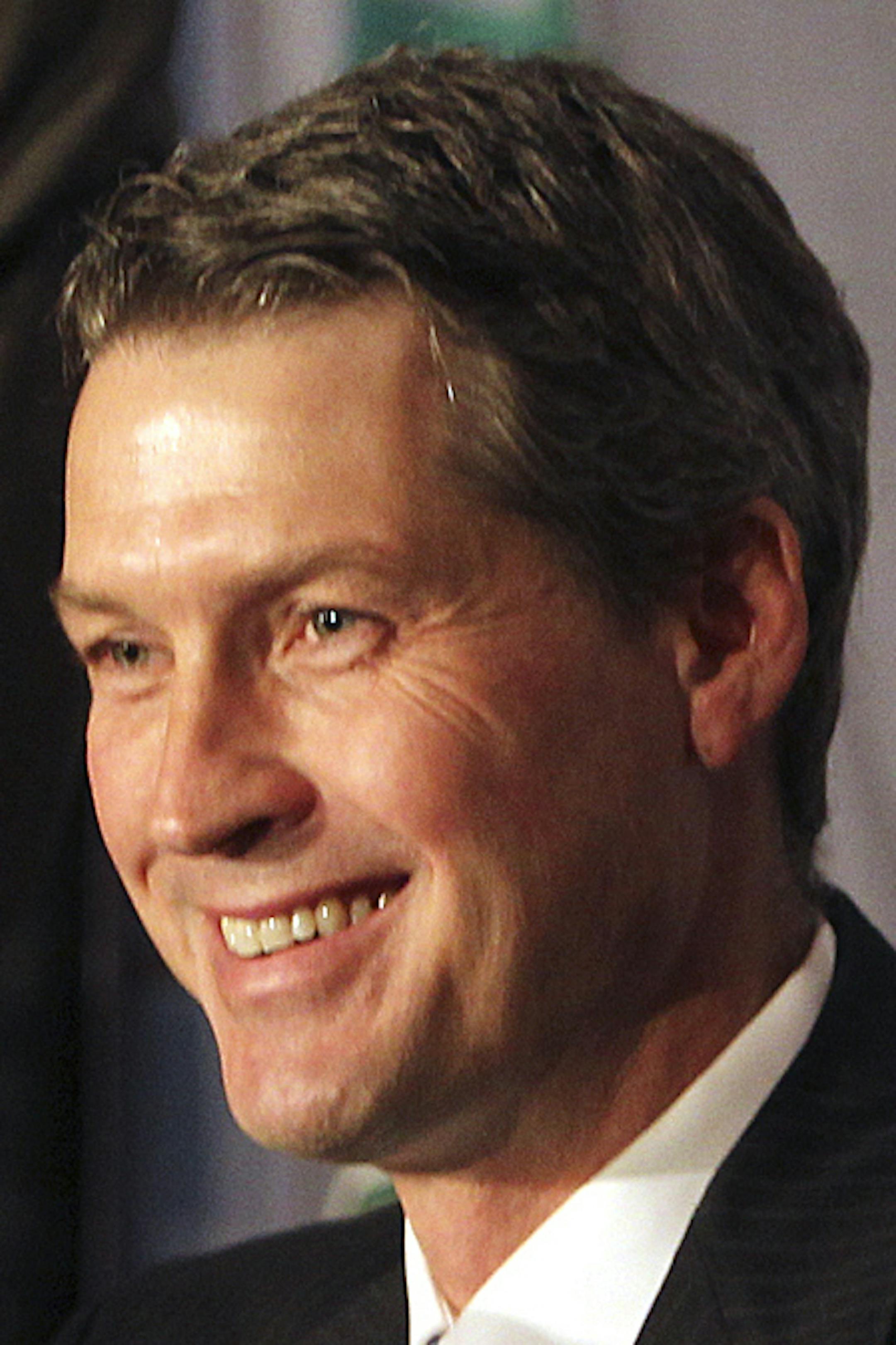 DAVID JOLES ‚Ä¢ djoles@startribune.com -June 17, 2011- St. Paul, MN- In this photo:] The Minnesota Wild introduce their new head coach Mike Yeo to the media. At 37, Yeo is the youngest head coach in the NHL. Here, Wild GM Chuck Fletcher, left, is pleased with new head coach Mike Yeo. ORG XMIT: MIN2013031822295017