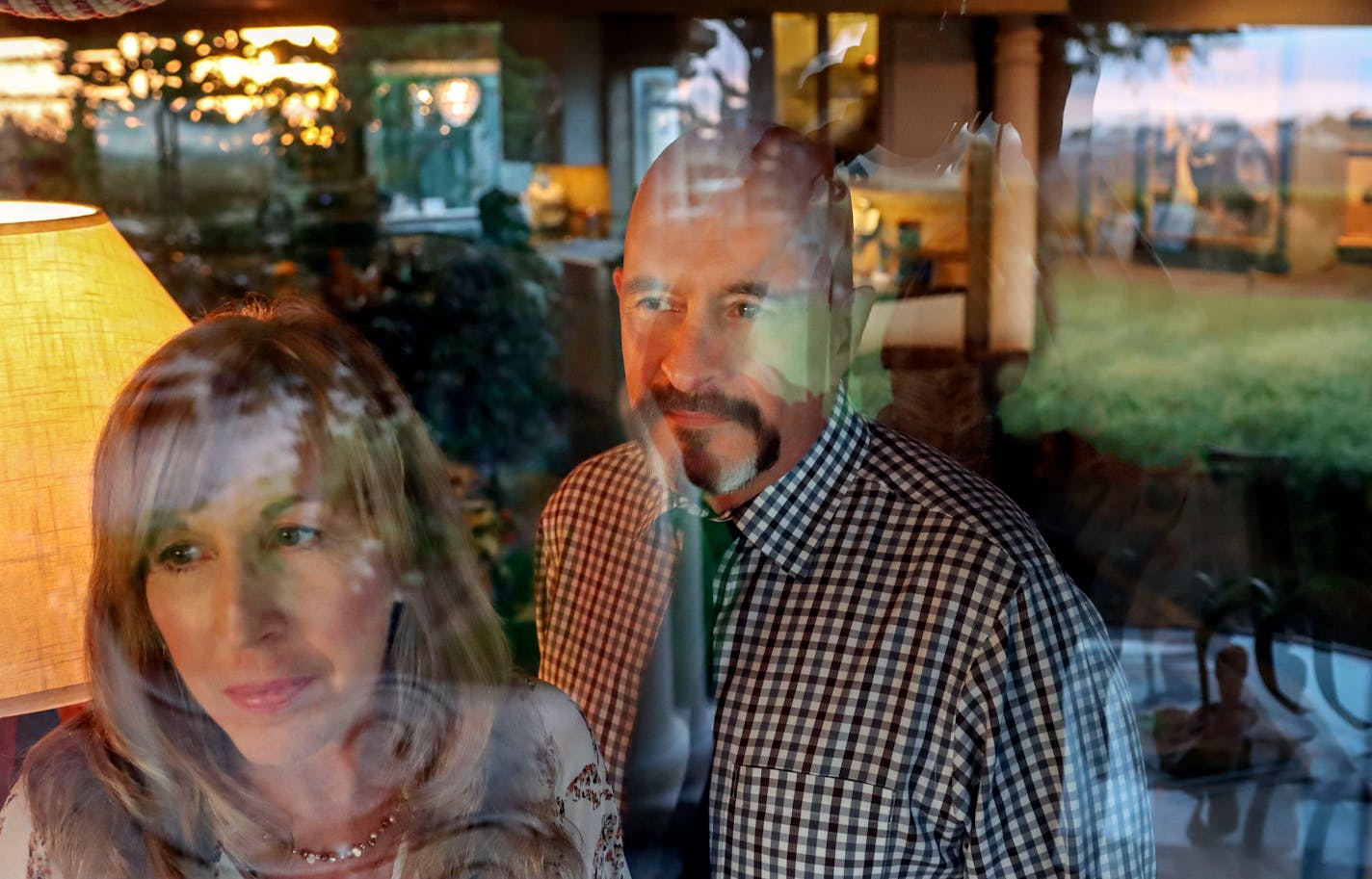 Dr. Christine Baser and her husband Dr. Thomas Habib stand at their home in Carlsbad, California on Aug. 3, 2021. They got Covid after a vacation in Provincetown and were fully vaccinated. MUST CREDIT: Sandy Huffaker for The Washington Post.