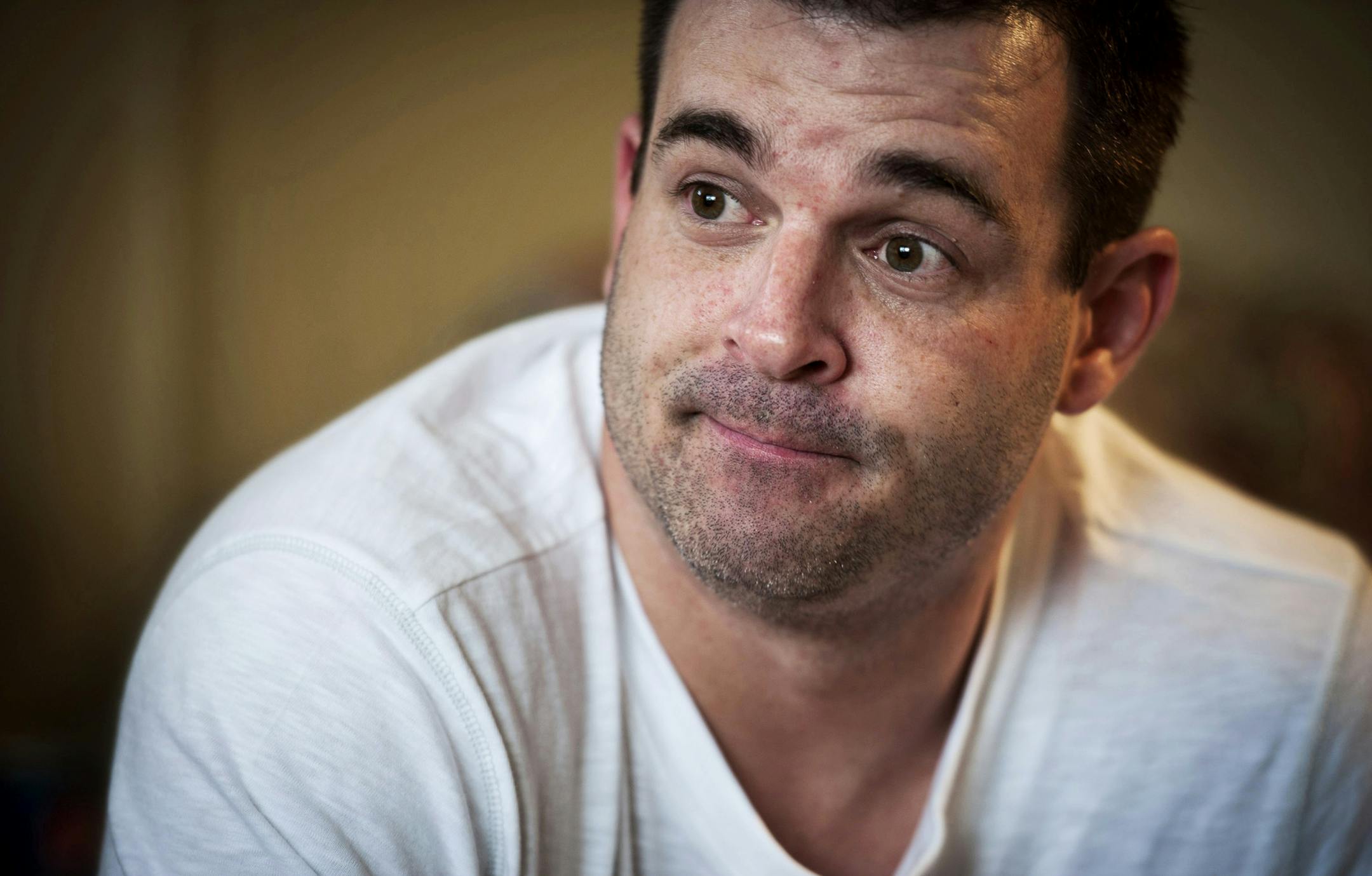 FILE - In this Dec. 14, 2012 file photo, Ryan Larson speaks during an interview. A Minnesota jury ruled Monday, Nov. 21, 2016, against Larson, who sued two media organizations over news stories that named him as a suspect in the 2012 killing of a Cold Spring, Minn., police officer. Larson accused the two outlets of defamation. He was arrested on suspicion of murder, but was released without charges. (Glen Stubbe/Star Tribune via AP, File)