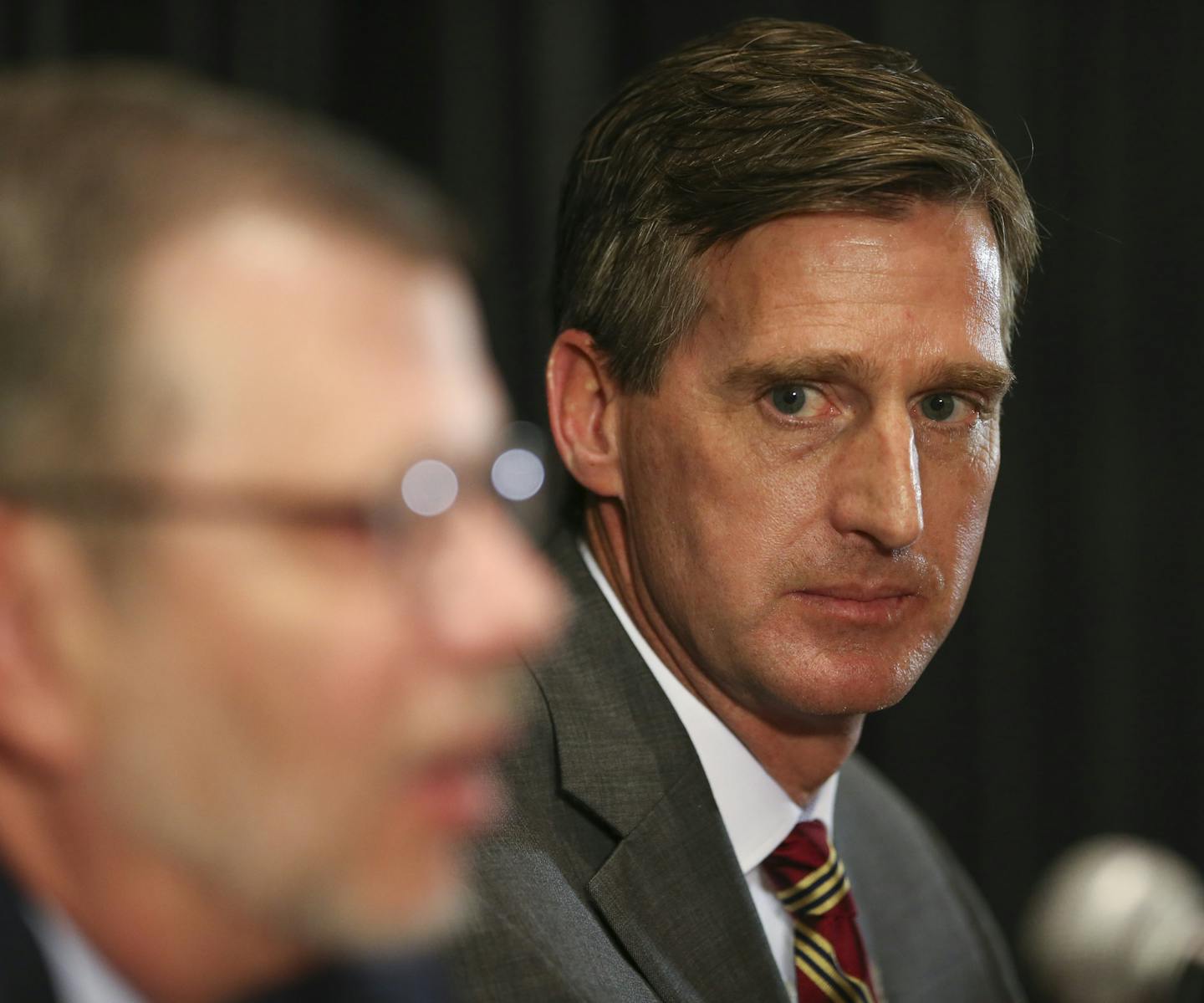 Former Syracuse athletic director Mark Coyle, shown with President Eric Kaler, arrives this week to take the helm as the new AD for the University of Minnesota.