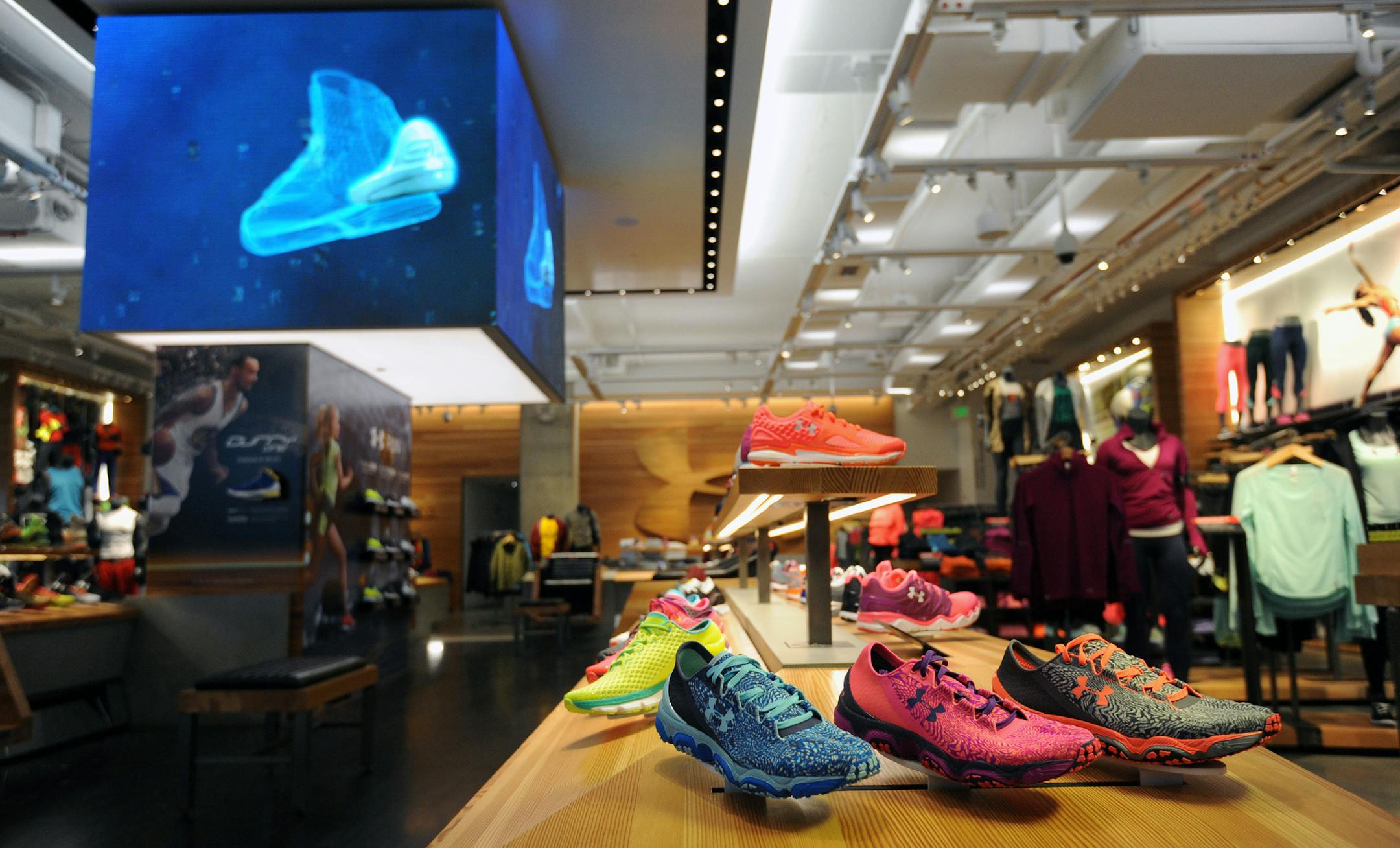 The women's shoe display at the Under Armour Brand House in Harbor East in Baltimore. A new Under Armour initiative aims to someday make more of its products locally. (Kim Hairston/Baltimore Sun/TNS) ORG XMIT: 1175115