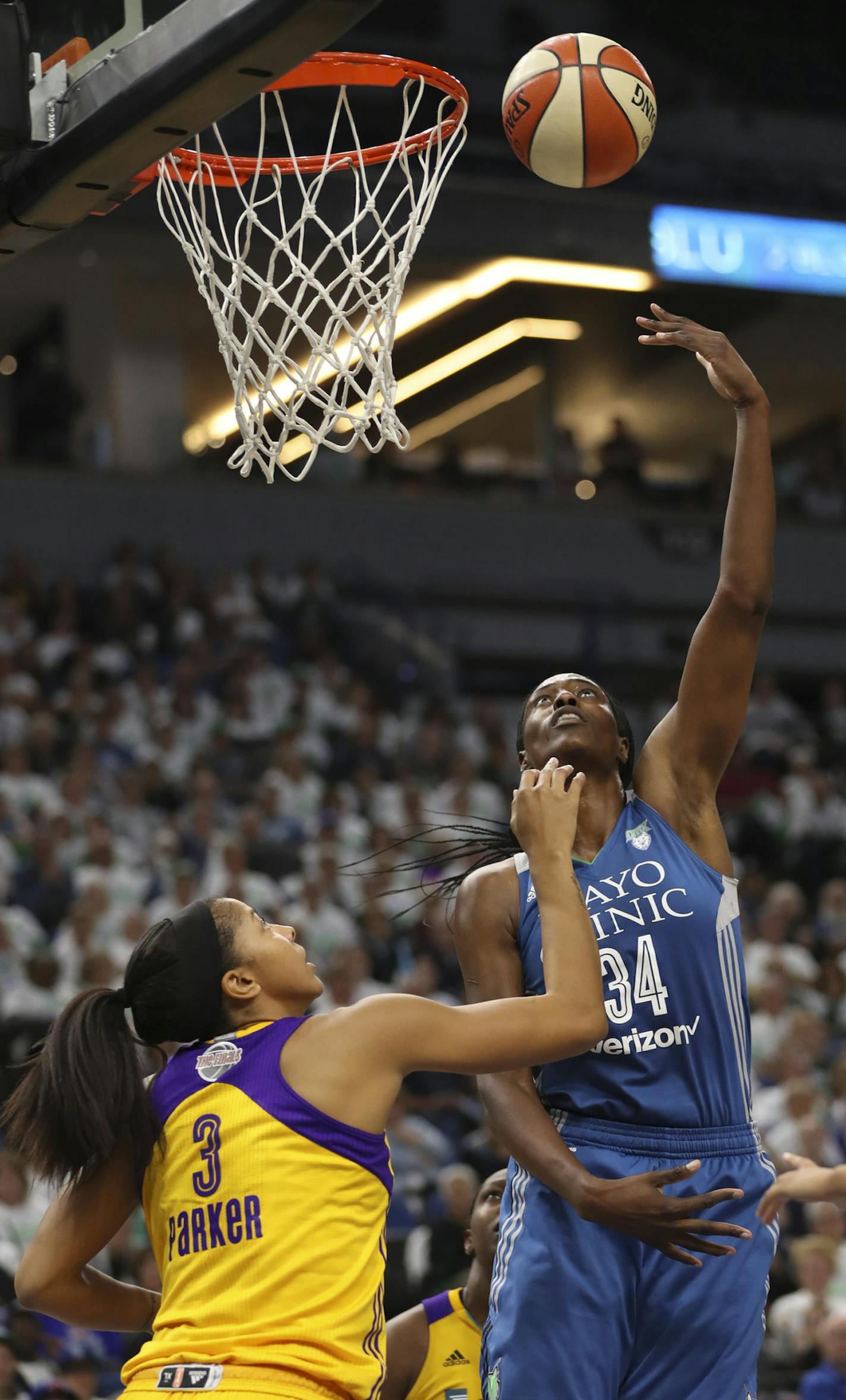 Lynx center Sylvia Fowles opened the WNBA Finals with a double-double of 18 points and 13 rebounds against Candace Parker and the Sparks on Sunday.