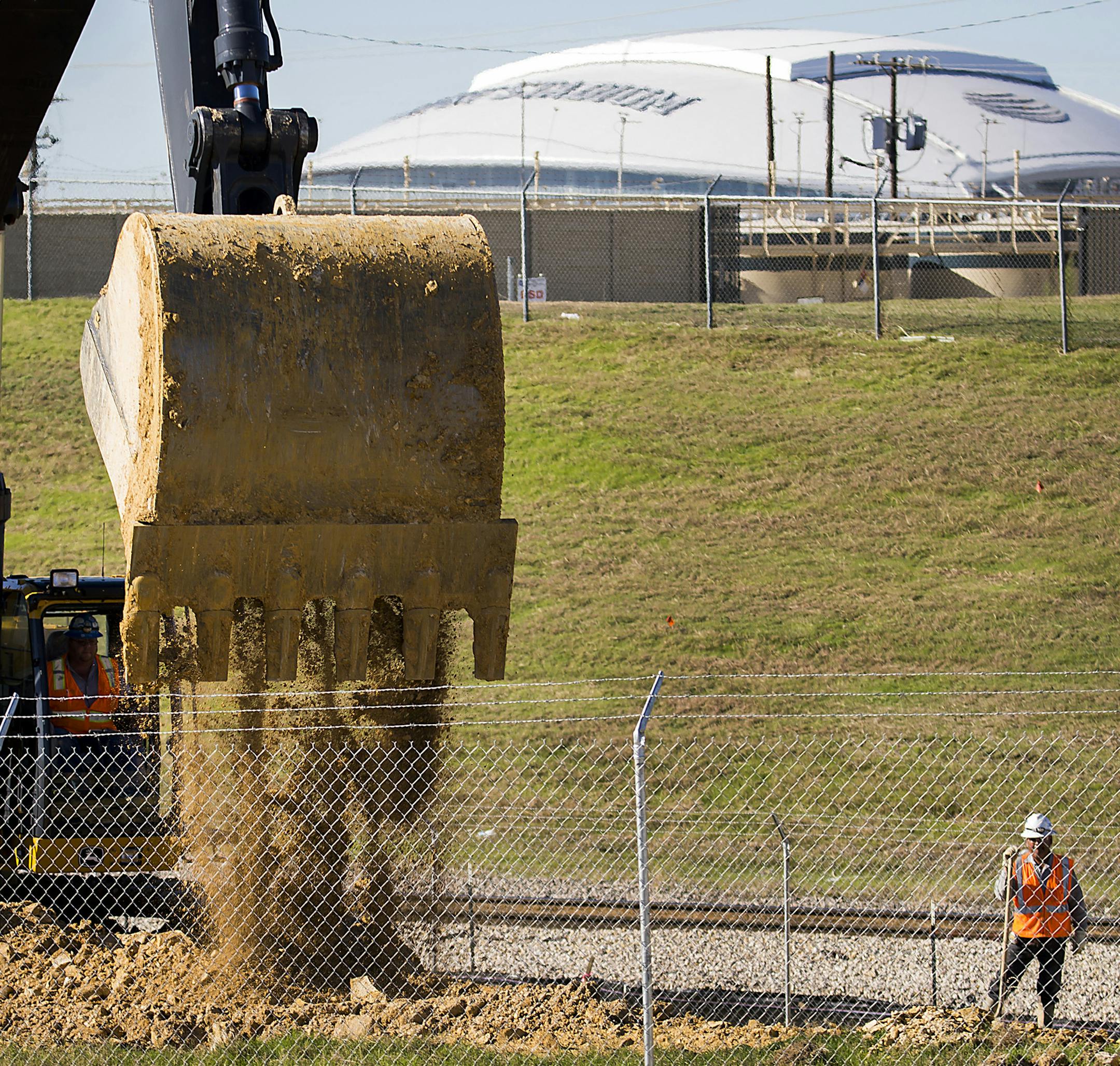 Construction workers do site preparation for expansion at the General Motors Assembly Plant on Monday, Dec. 14, 2015, in Arlington, Texas. GM has begun a massive $1.4 billion expansion project at the plant. (Smiley N. Pool/The Dallas Morning News/TNS) ORG XMIT: 1178653