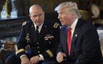 President Donald Trump, right, speaks as Army Lt. Gen. H.R. McMaster, left, listens at Trump's Mar-a-Lago estate in Palm Beach, Fla., Monday, Feb. 20,