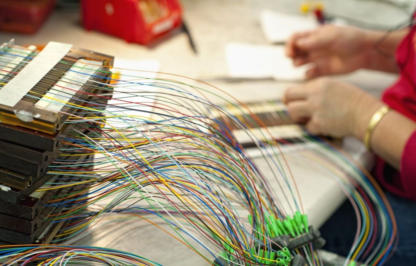 Cynthia Lor fitted connector ends onto a cable containing containing individual fiber optic fibers at Clearfield.