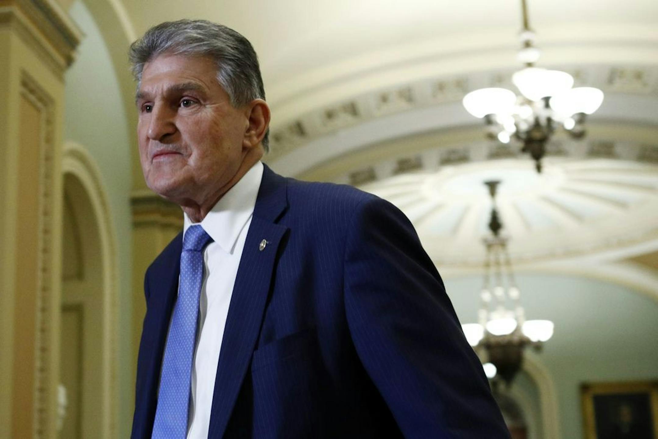 Sen. Joe Manchin, Joe, D-W.Va., walks to the Senate chamber after a break in the impeachment trial of President Donald Trump at the U.S. Capitol Wednesday Jan 29, 2020, in Washington.