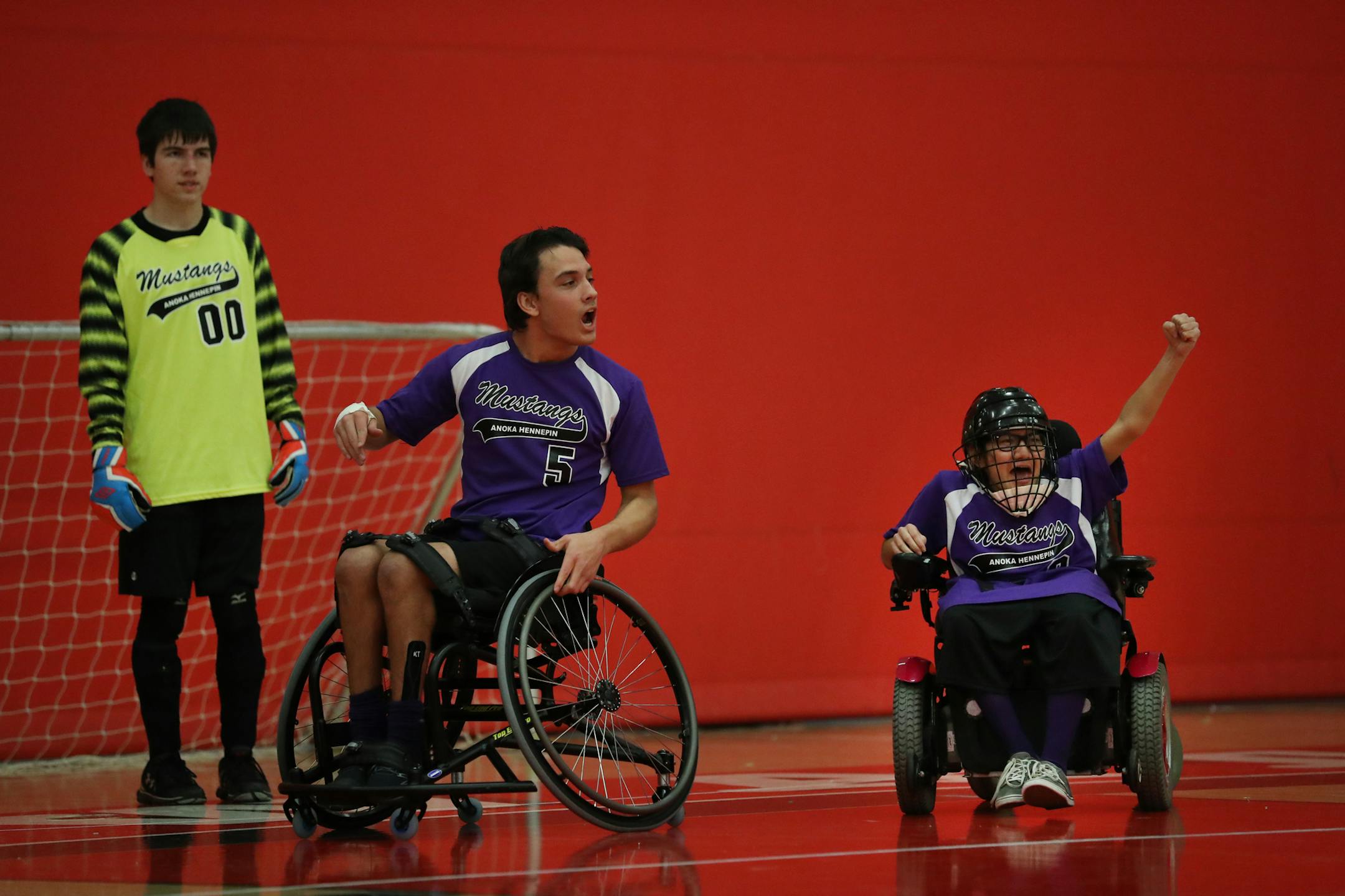 Anoka-Hennepin players (L to R) Joey Manion, Ben Schmitz and Mia France celebrated a goal scored on the other end of the floor. ] Shari L. Gross / sgross@startribune.com Anoka-Hennepin defeated Robbinsdale 3-1 in the physically impaired adapted P1 soccer championship game at Stillwater High School on Saturday, November 19, 2016 in Oak Park Heights, Minn.