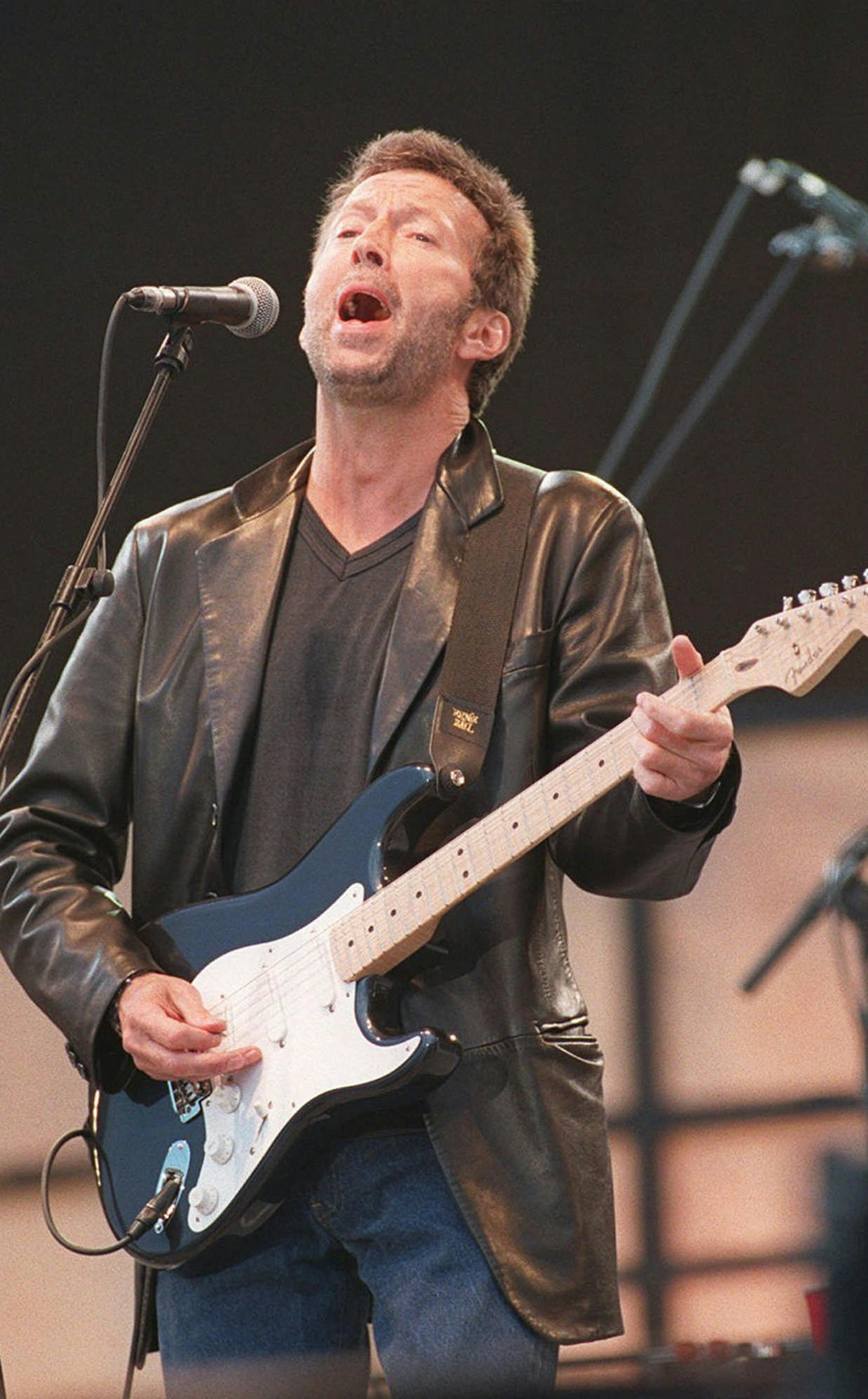 Rock star Eric Clapton performs at the charity rock concert in London's Hyde Park, June 29, 1996 in aid of the Prince's Trust. Clapton's "Change the World" has been nominated for record of the year, song of the year and best male pop vocal performance. (AP Photo/Louisa Buller)