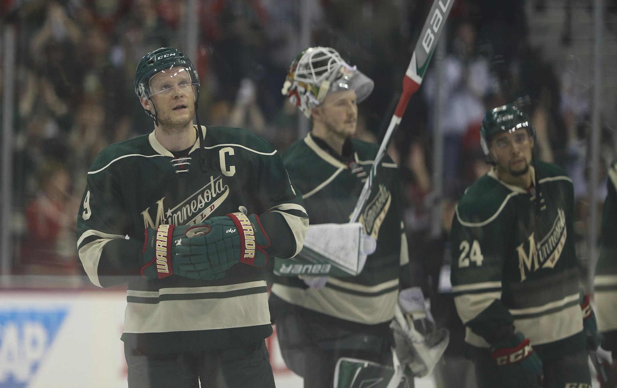Minnesota Wild captain Mikko Koivu (9) stood at center ice as the team saluted the fans after the game Sunday afternoon. ] JEFF WHEELER ï jeff.wheeler@startribune.com The Minnesota Wild lost to the Dallas Stars 5-4 in game 6 of their NHL first round playoff series Sunday afternoon, April 24, 2016 at Xcel Energy Center in St. Paul.