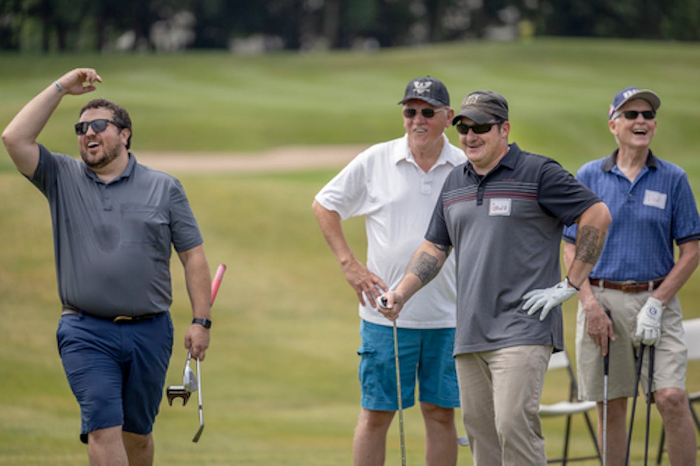 Dan Tengwall, far left, reacts to a put as he and other PGA Hope participants learn how to golf at Chaska Town Course in Chaska, Minn., on Wednesday, July 6, 2022. Military veterans who served during Vietnam, Iraq, and Afghanistan, participated in free golf lessons provided by an organization known as PGA Hope. Starting July 7, post-9/11 veterans from Minnesota are eligible for one-time cash bonuses from the state. It's part of a Minnesota tradition for every major conflict dating back to World War I. Veterans who were active duty during the Global War on Terror get $600; those who served in combat zone get $1,200; Gold Star families get $2,000. ] Elizabeth Flores • liz.flores@startribune.com