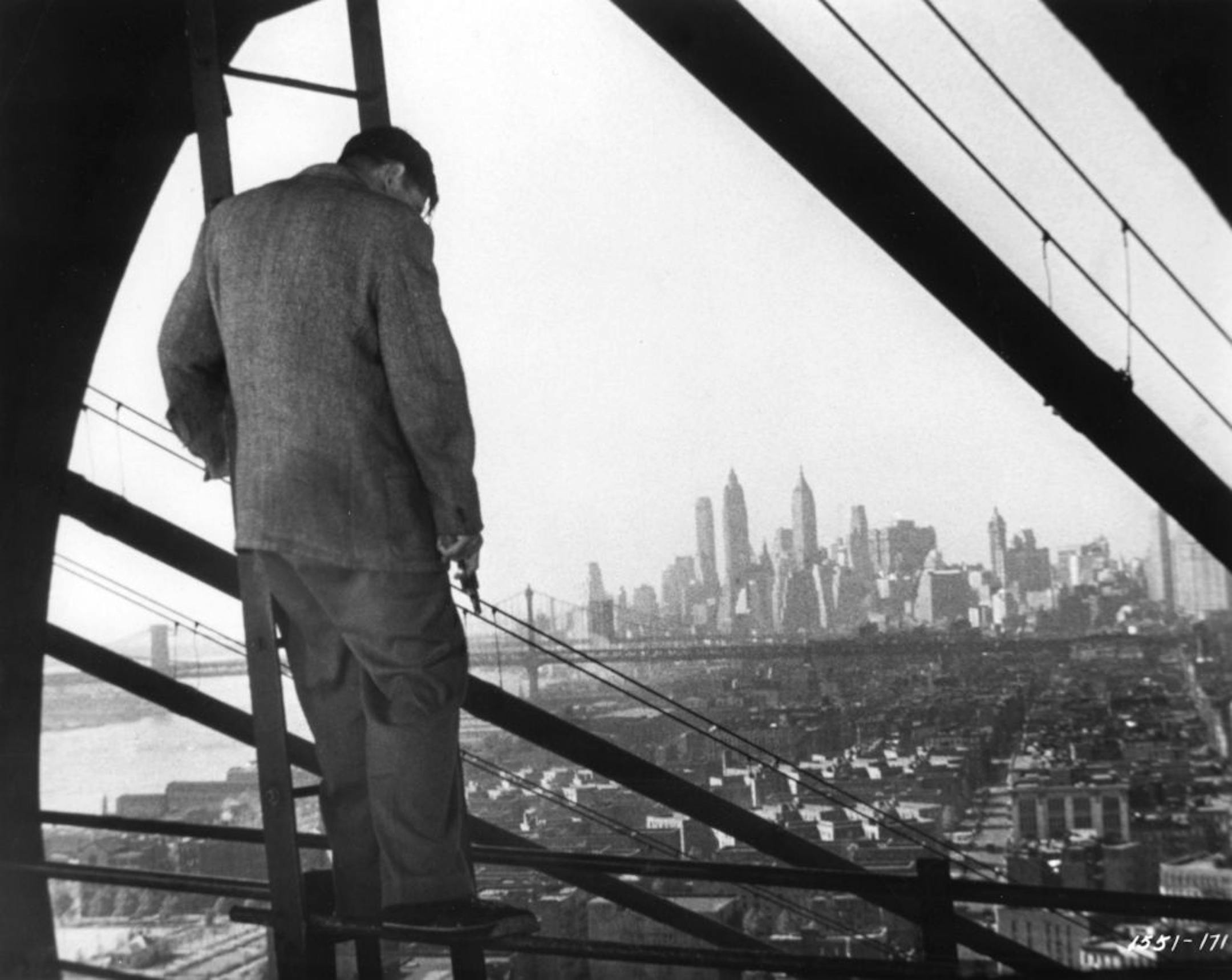 A murder suspect is trapped on a bridge in a scene from the 1948 movie "The Naked City."