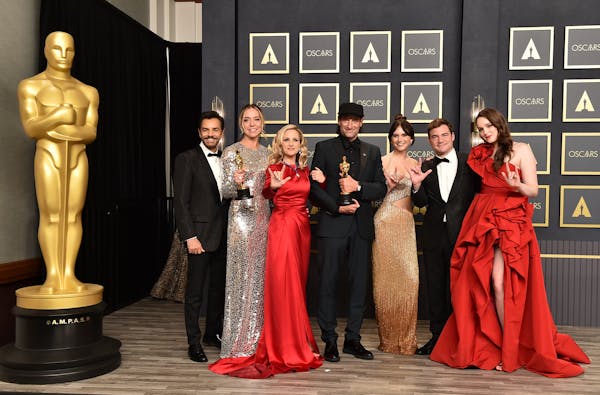 Eugenio Derbez, from left, Sian Heder, Marlee Matlin, Troy Kotsur, Emilia Jones, Daniel Durant, and Amy Forsyth, winners of the award for best picture