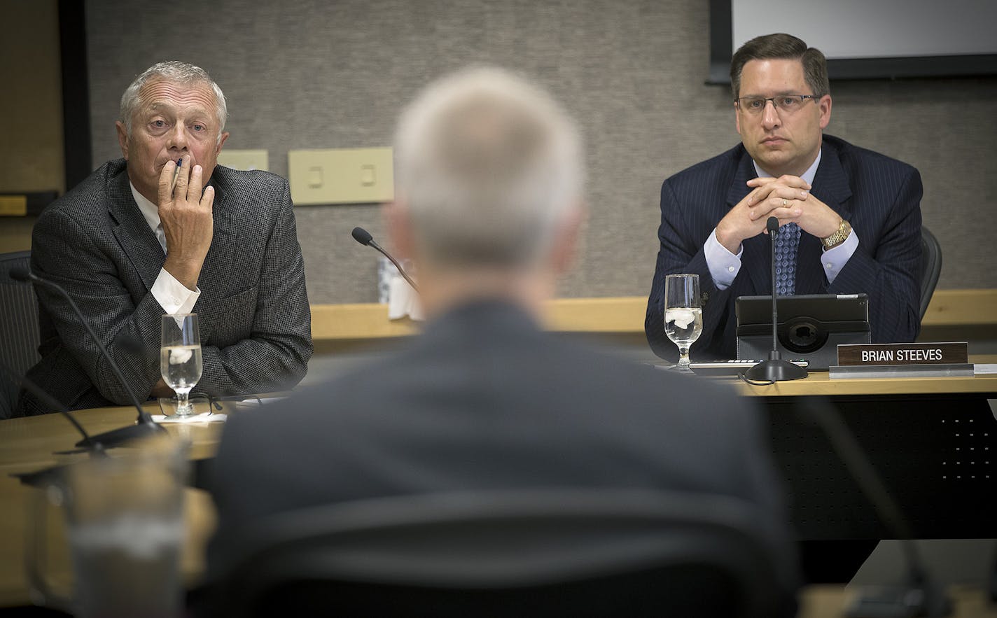 FILE -- University of Minnesota regent Steve Sviggum, left, and Brian Steeves, executive director of the regents board, listened during a regents meeting in August.