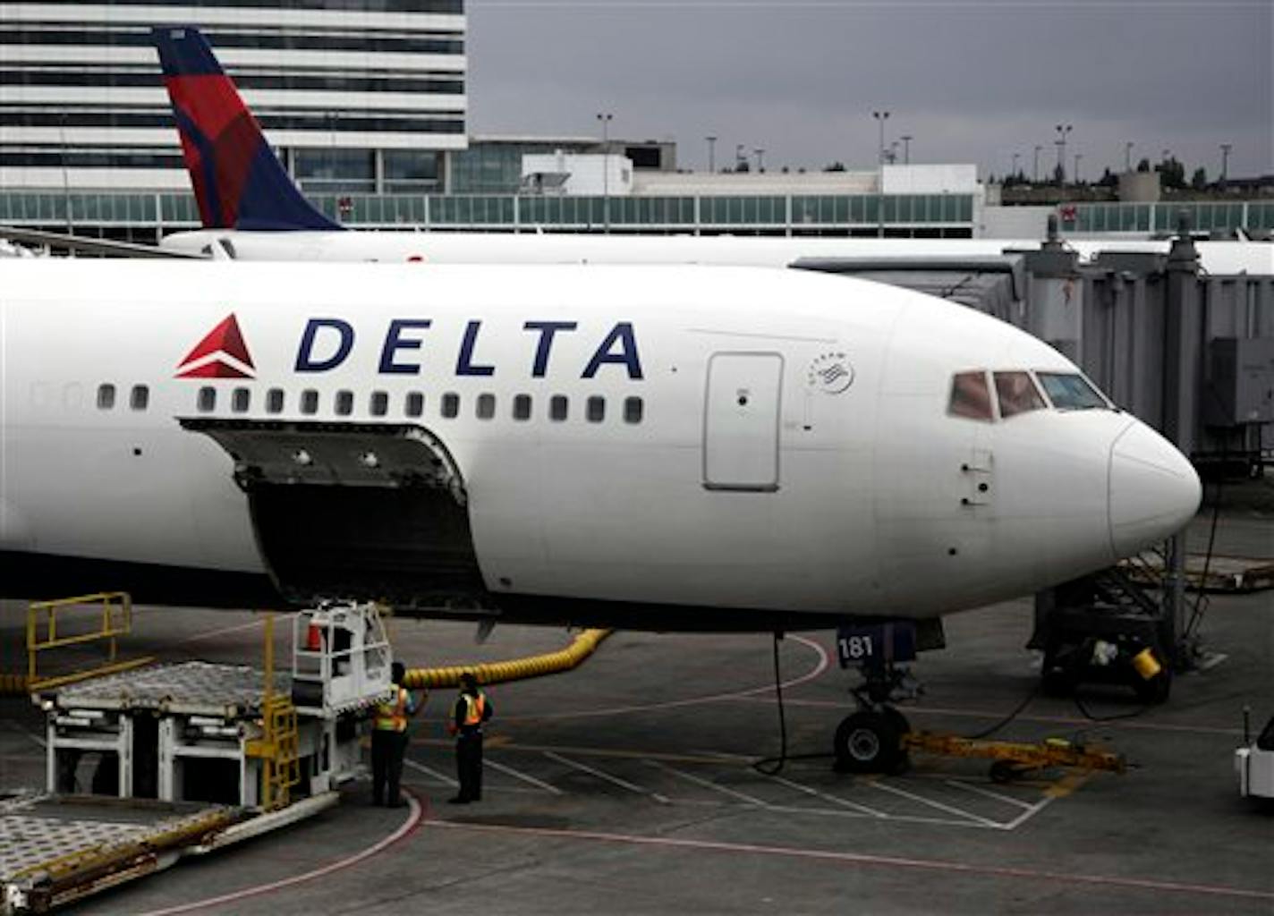 FILE - In this file photo made June 7, 2010, a Delta Airlines Inc. plane sits on the tarmac at Seattle-Tacoma International Airport in Seattle.