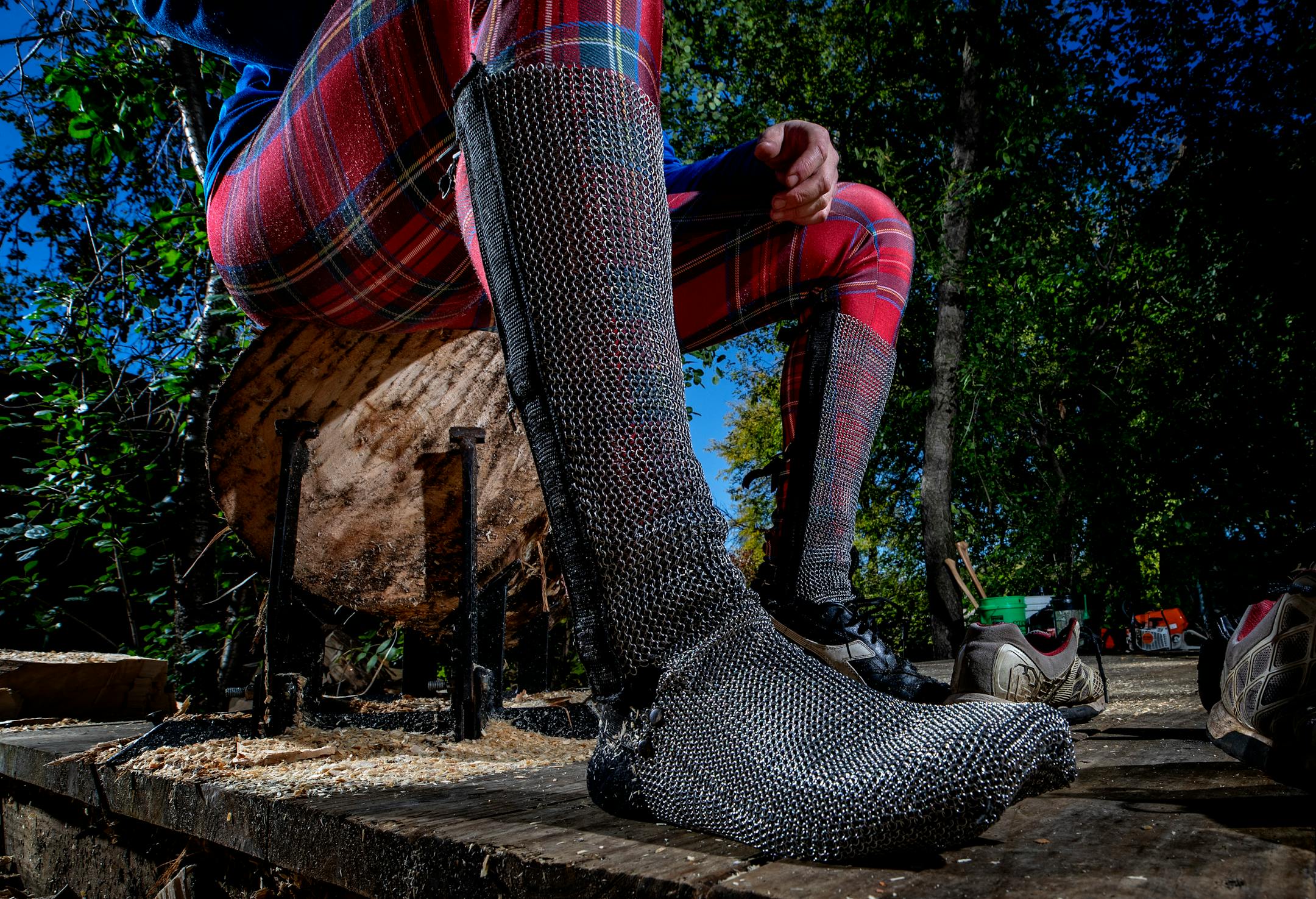 Scheer uses chain mail protection for his feet and shins. ] CARLOS GONZALEZ • cgonzalez@startribune.com – Golden Valley, MN – October 17, 2019, One of best in the world, Cassidy Scheer of the legendary lumberjacking Scheer family, trains in his backyard in Golden Valley