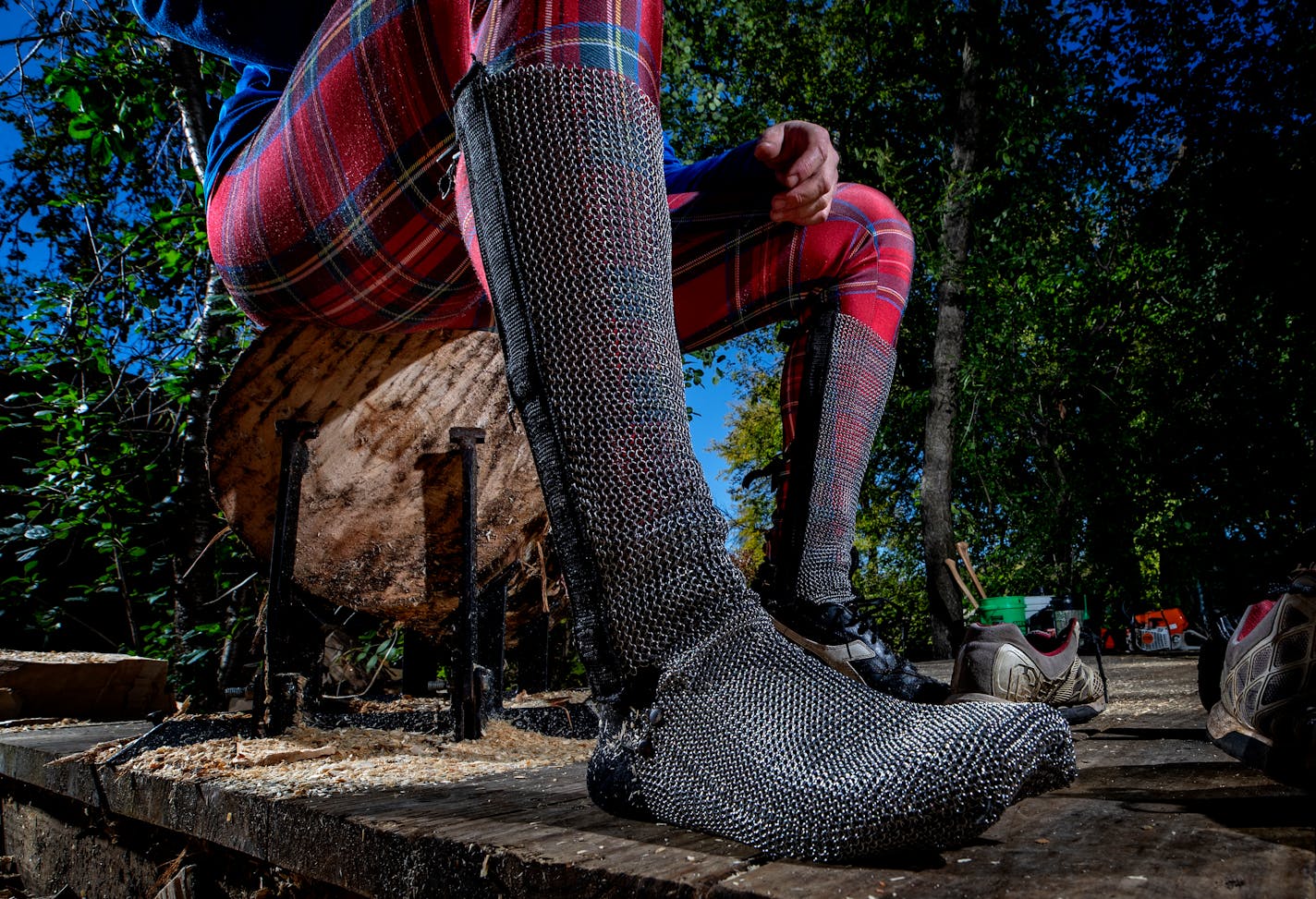 Scheer uses chain mail protection for his feet and shins. ] CARLOS GONZALEZ • cgonzalez@startribune.com – Golden Valley, MN – October 17, 2019, One of best in the world, Cassidy Scheer of the legendary lumberjacking Scheer family, trains in his backyard in Golden Valley