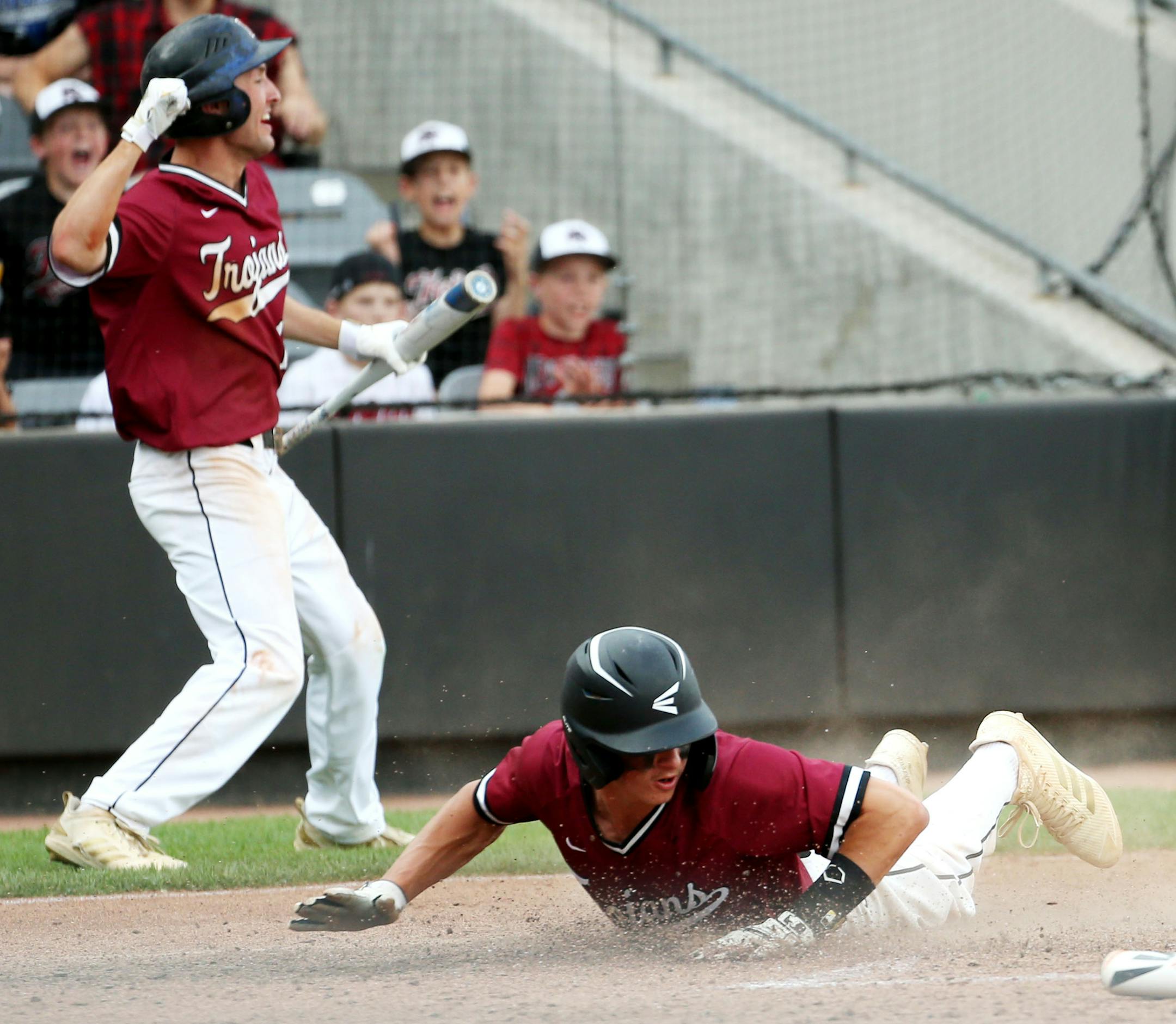 New Prague infielder Jake Deutsch (1) slides home during the seventh inning. ] NICOLE NERI • nicole.neri@startribune.com BACKGROUND INFORMATION: Blaine vs. New Prague in the Class 4A baseball state quarterfinals Friday, June 14, 2019