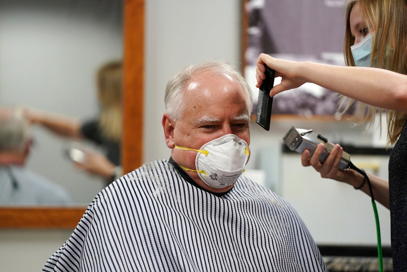 Gov. Tim Walz got a haircut by Erin Diede on Friday at Capitol Barbers in the Minnesota State Office Building in St. Paul.