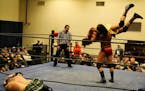 Ryan Slade prepared to body-slam Tommy Lee Curtis on a recent Steel Domain Wrestling card as referee Jesse Johnson watched. Aaron Corbin, meantime, wr